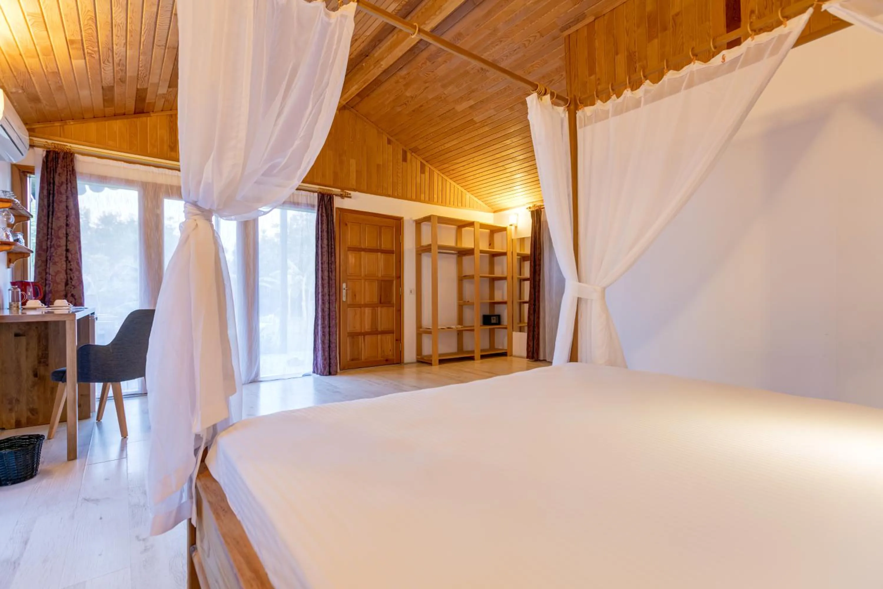 Bed in Etenna Beach Bungalows