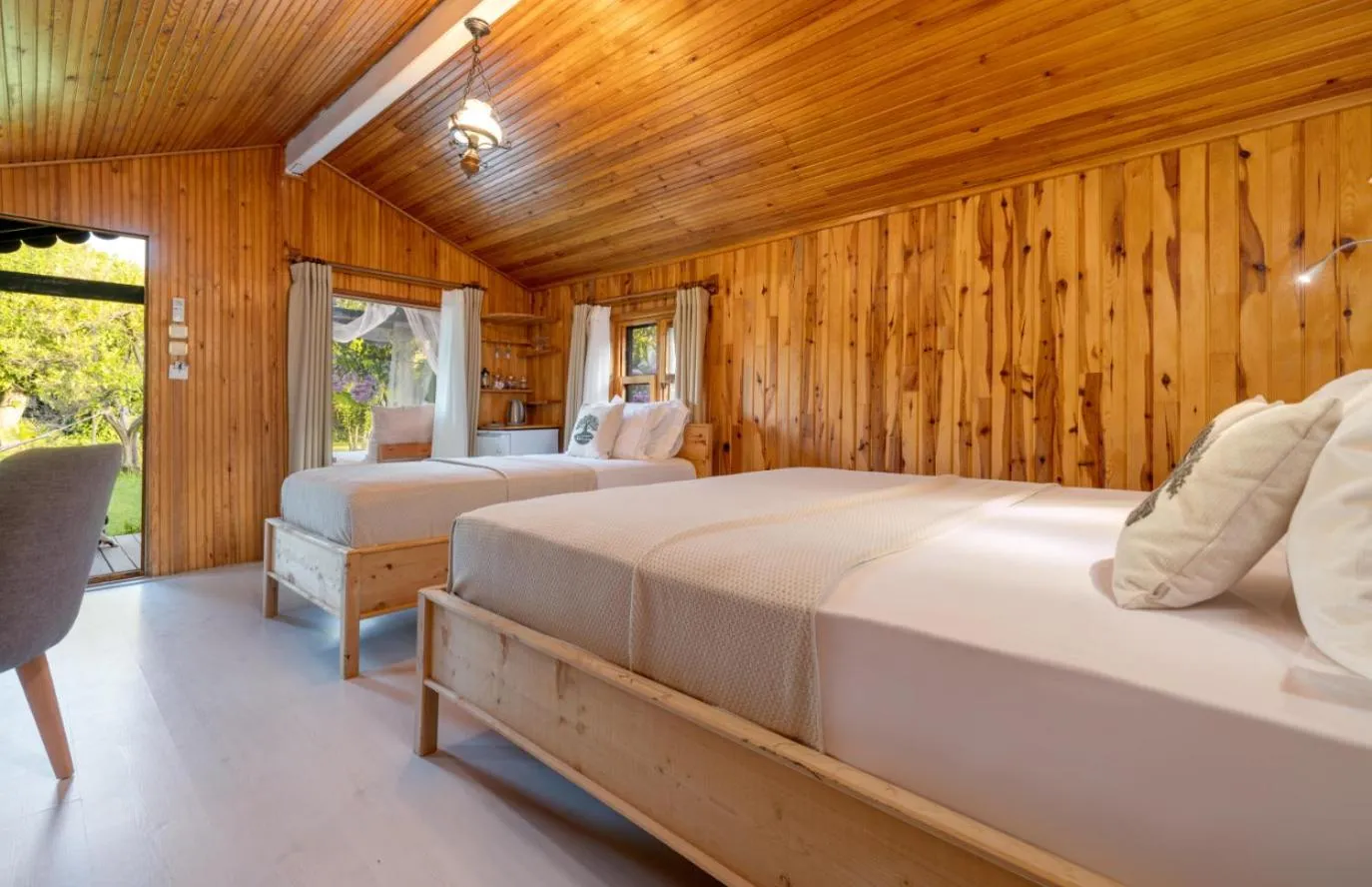 Bed in Etenna Beach Bungalows