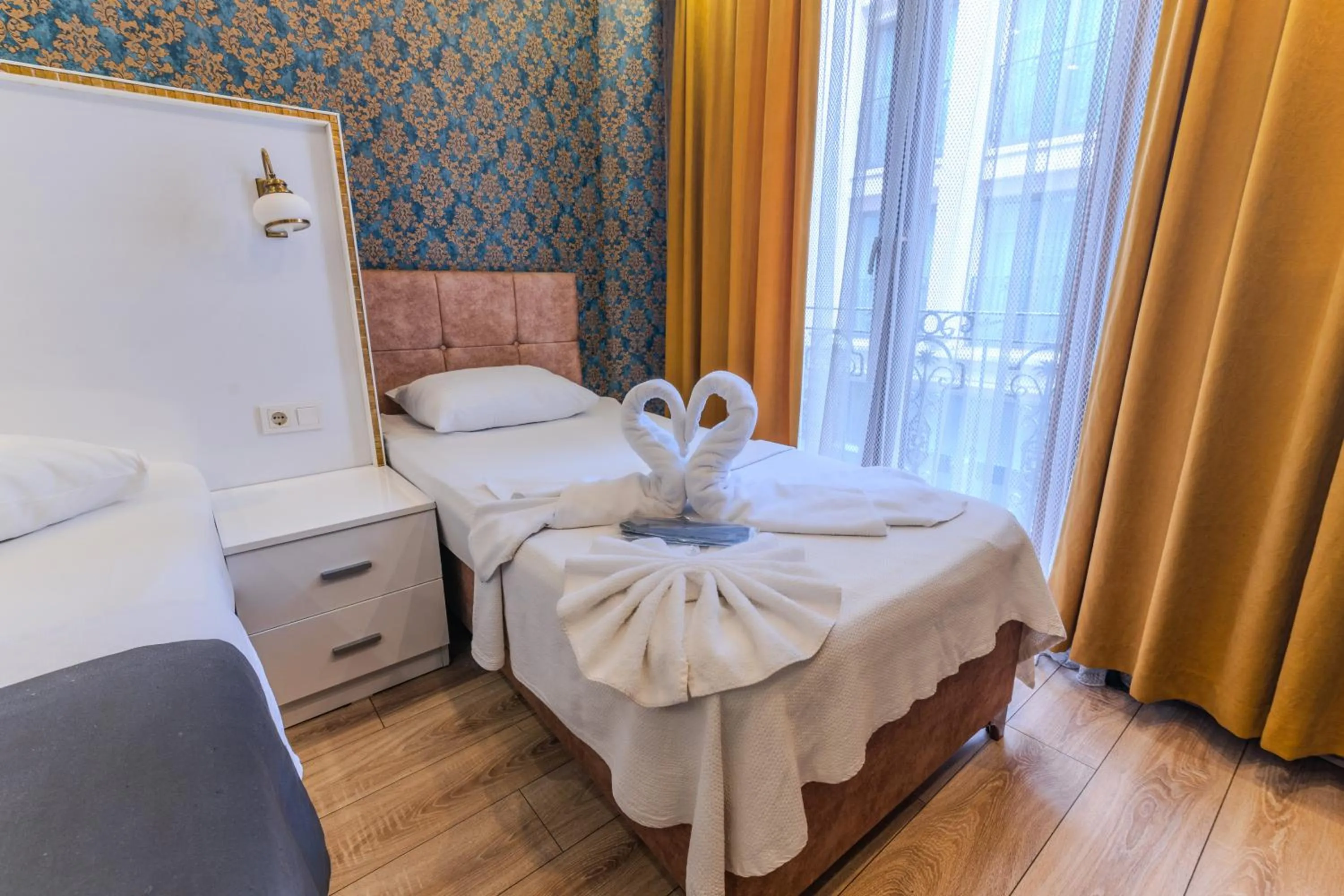 Bed in Dolce Vita Suite Hotel