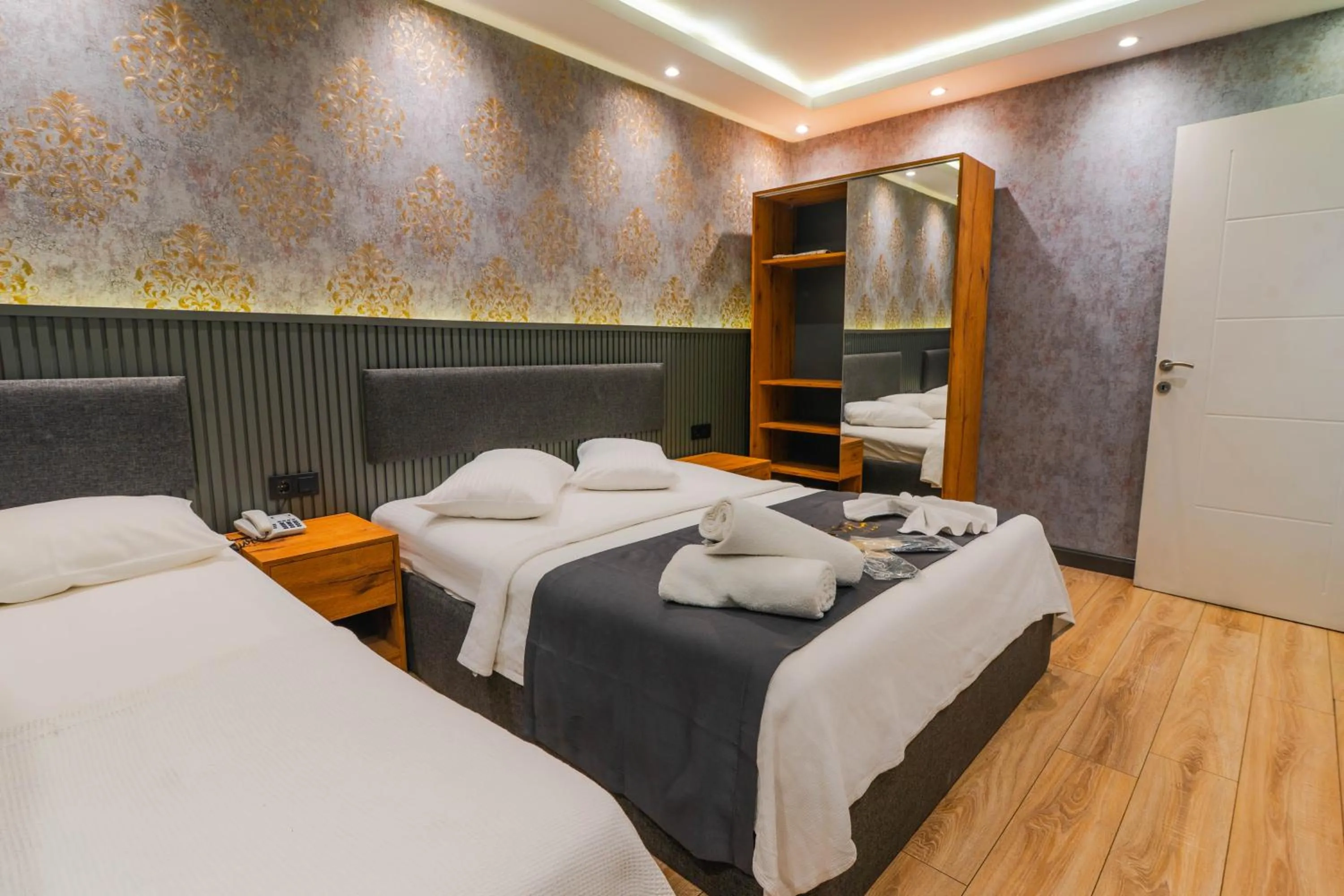 Bed in Dolce Vita Suite Hotel