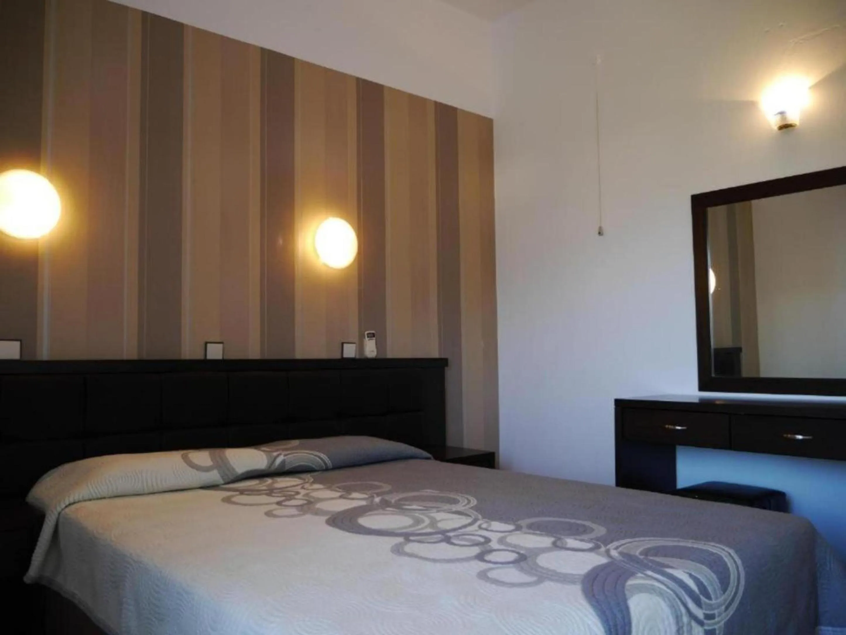 Bed in Blue Bay Beach Hotel