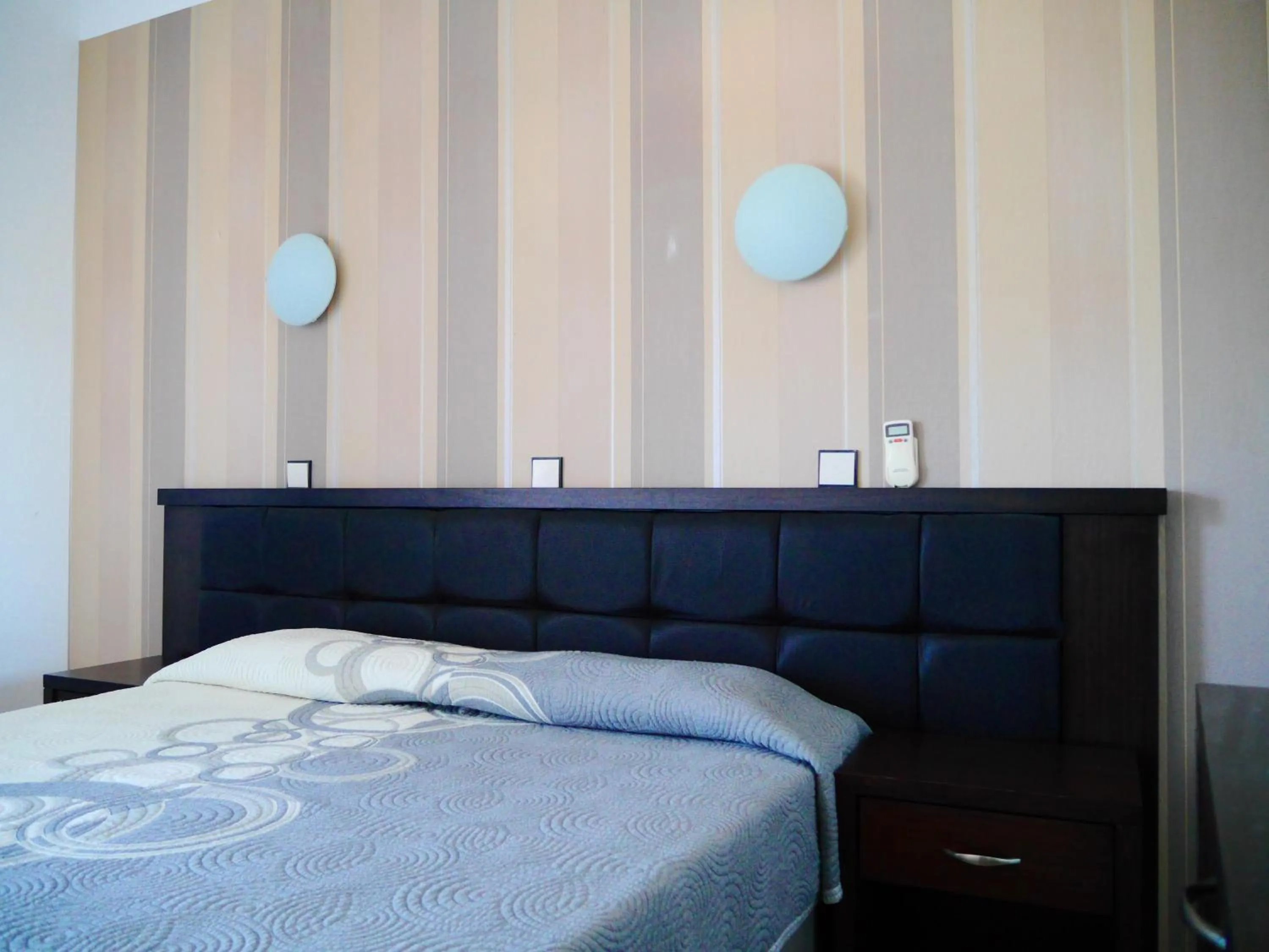 Bed in Blue Bay Beach Hotel