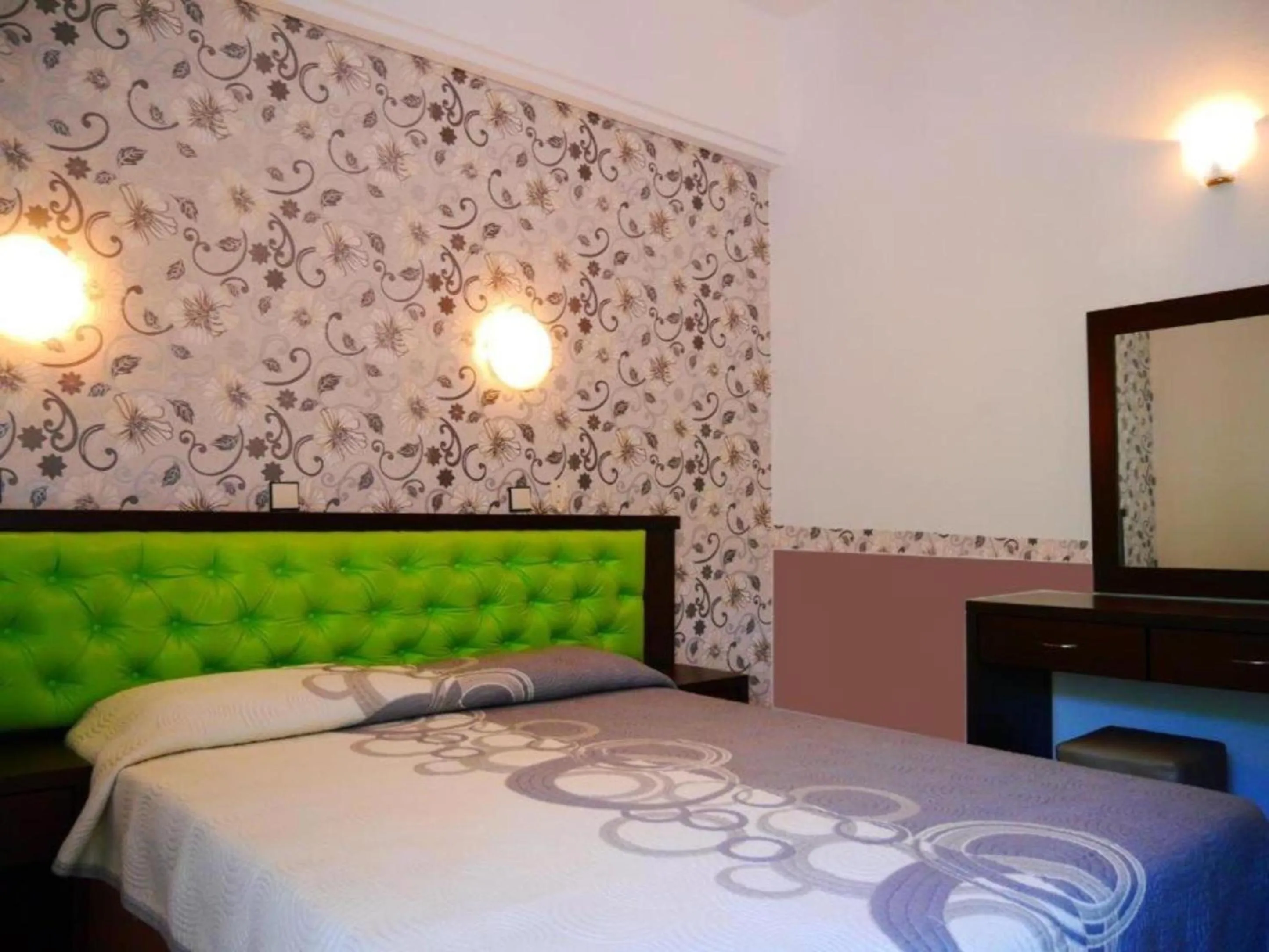 Bed in Blue Bay Beach Hotel