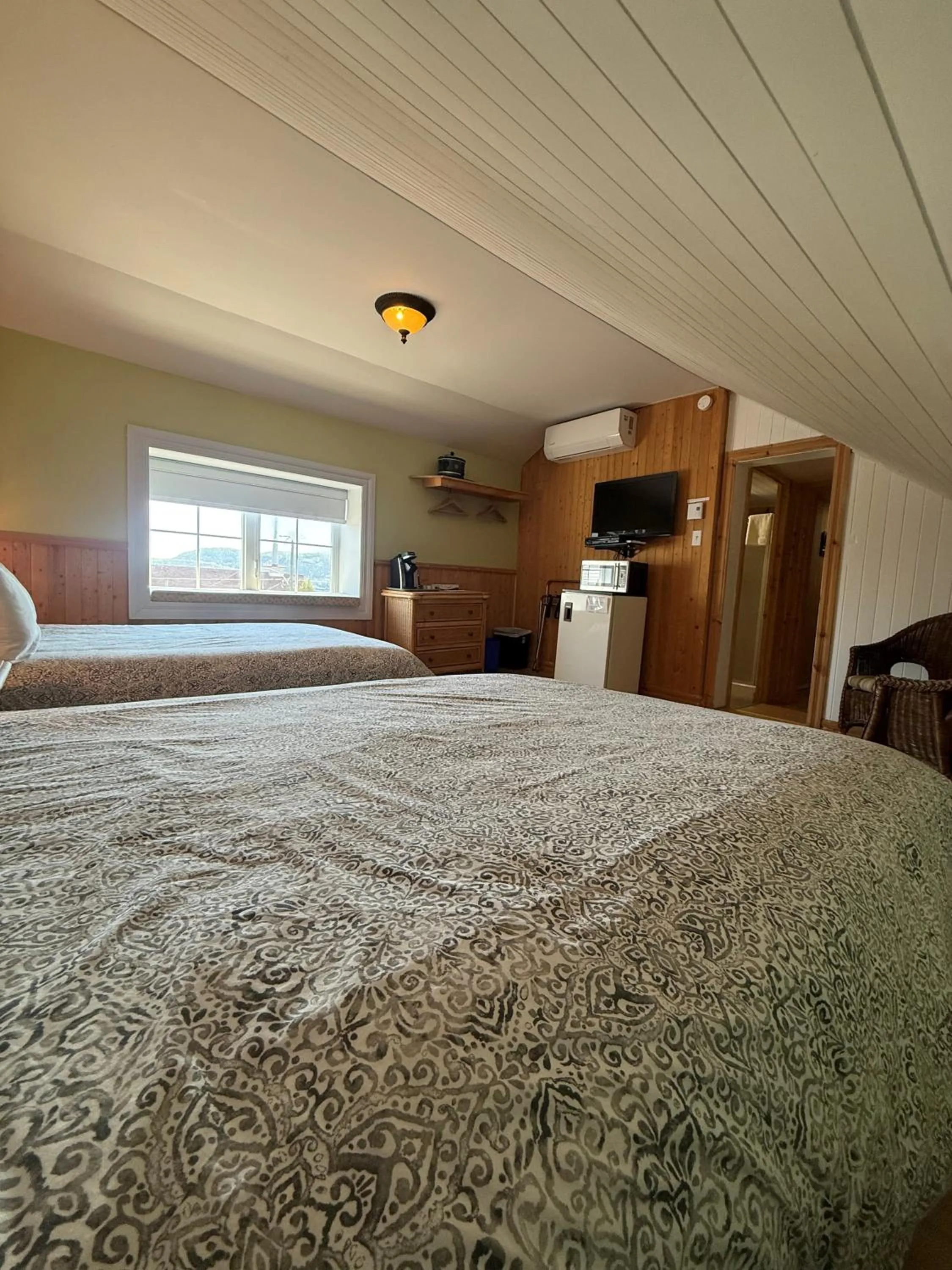 Bed in La Galouine Auberge