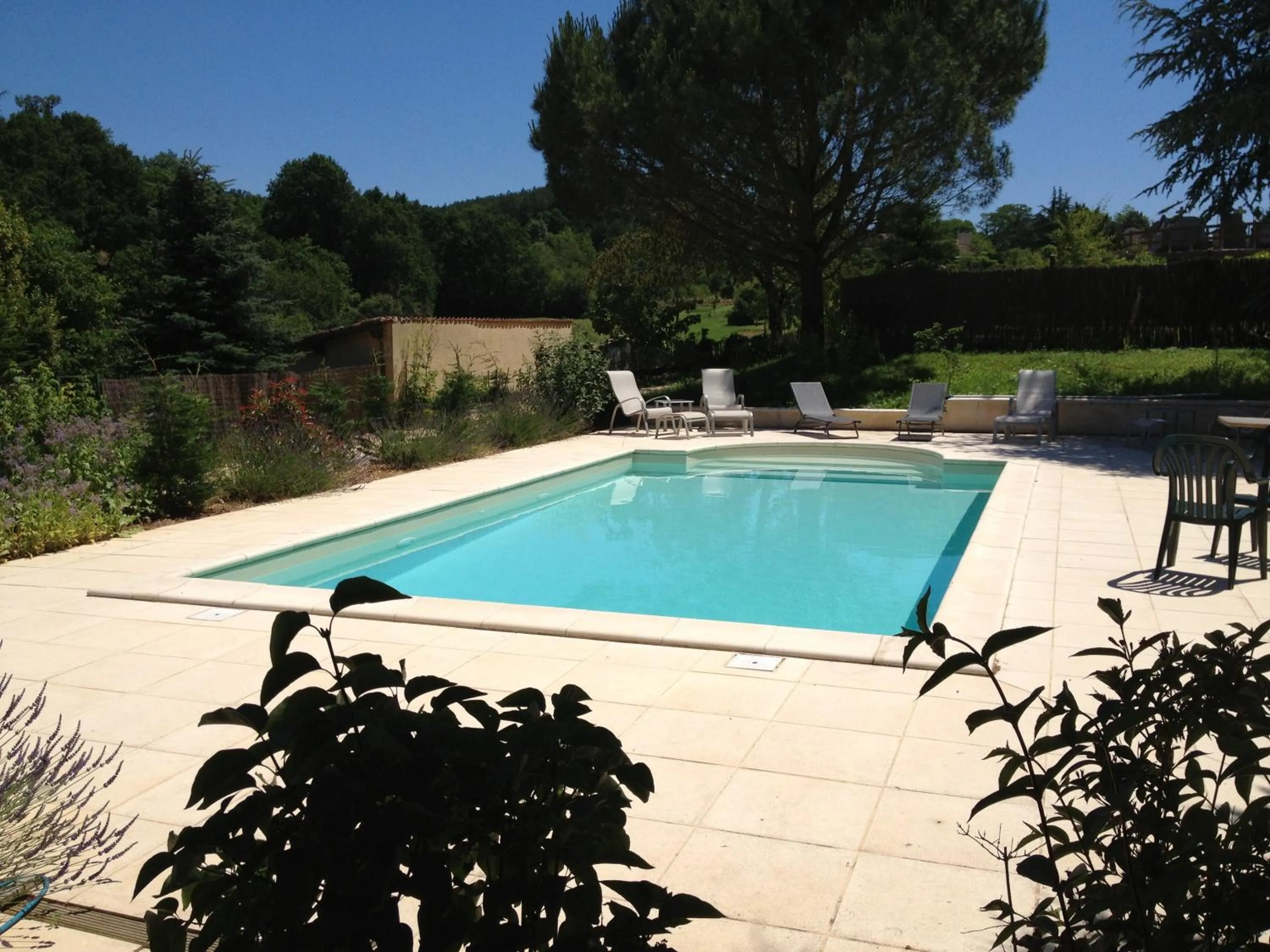Swimming pool in Logis Hôtel Restaurant La Bastide