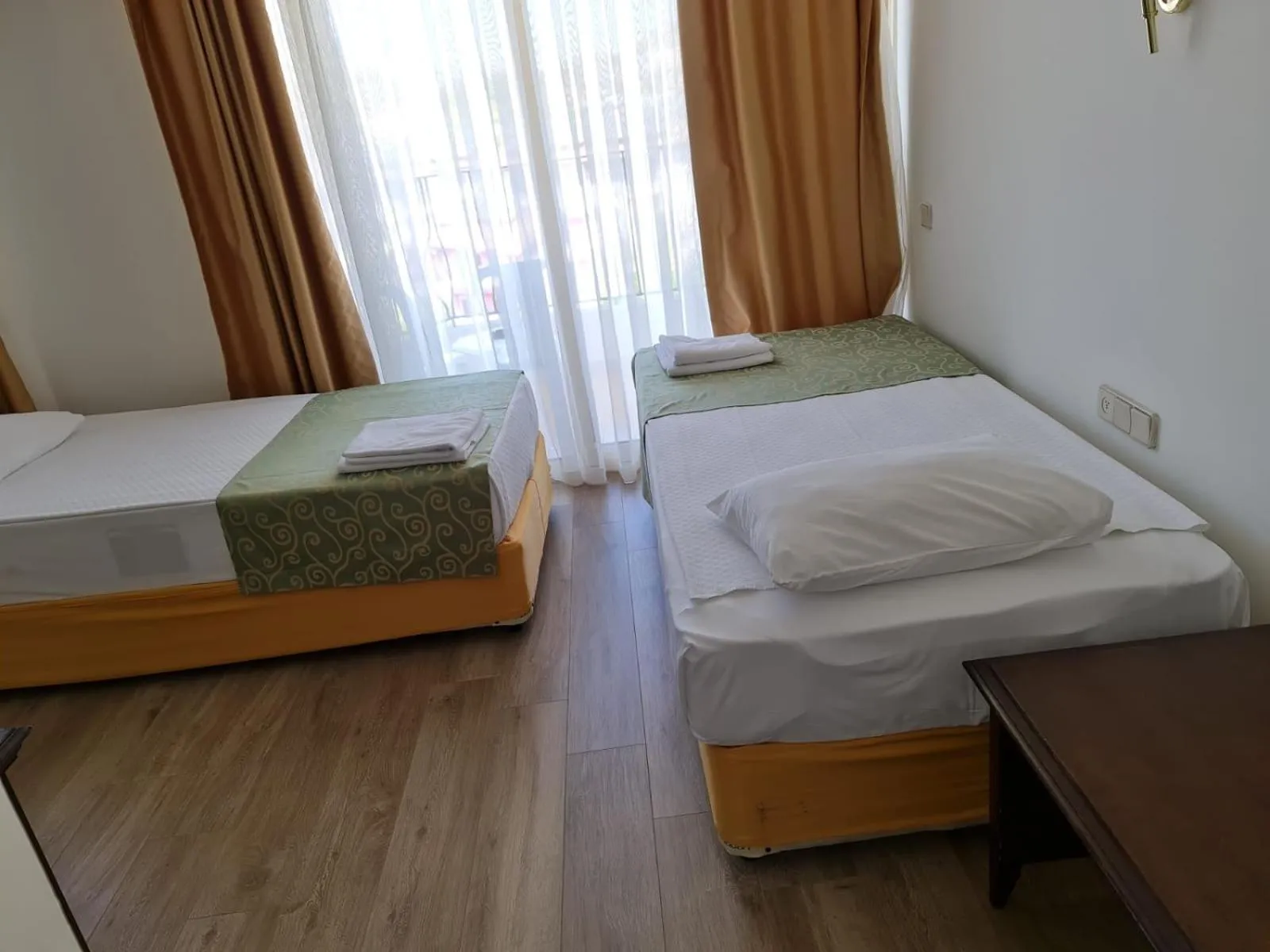 Bed in Side Palm D'or Hotel