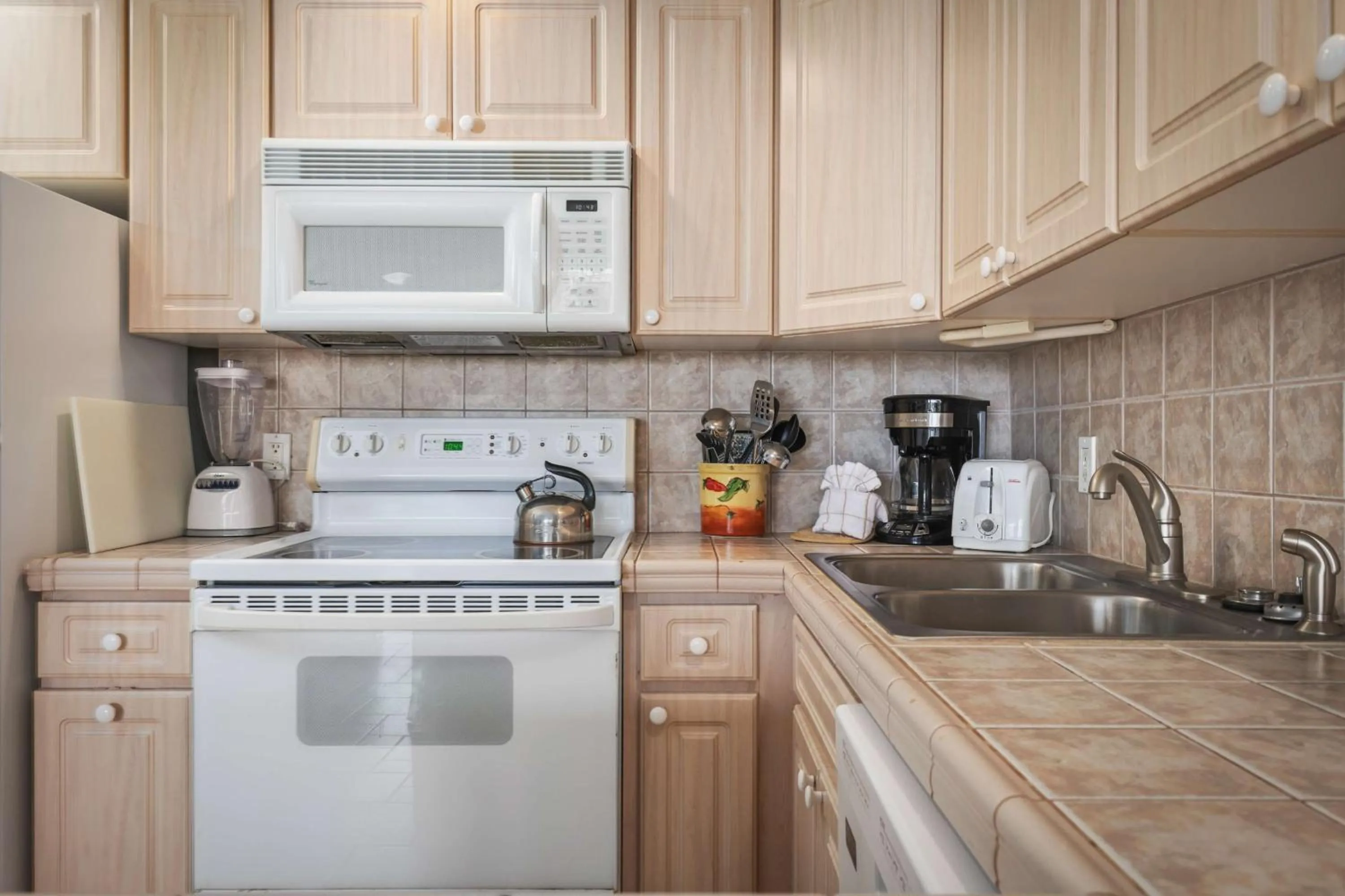 Kitchen or kitchenette in Aston at Papakea Resort