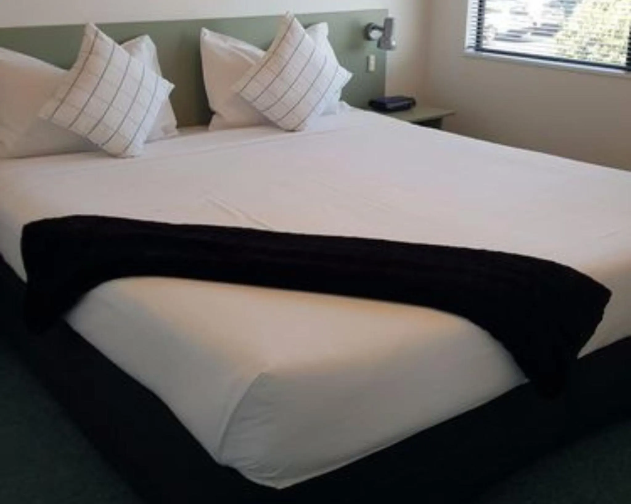 Bed in ASURE Abode On Courtenay Motor Inn