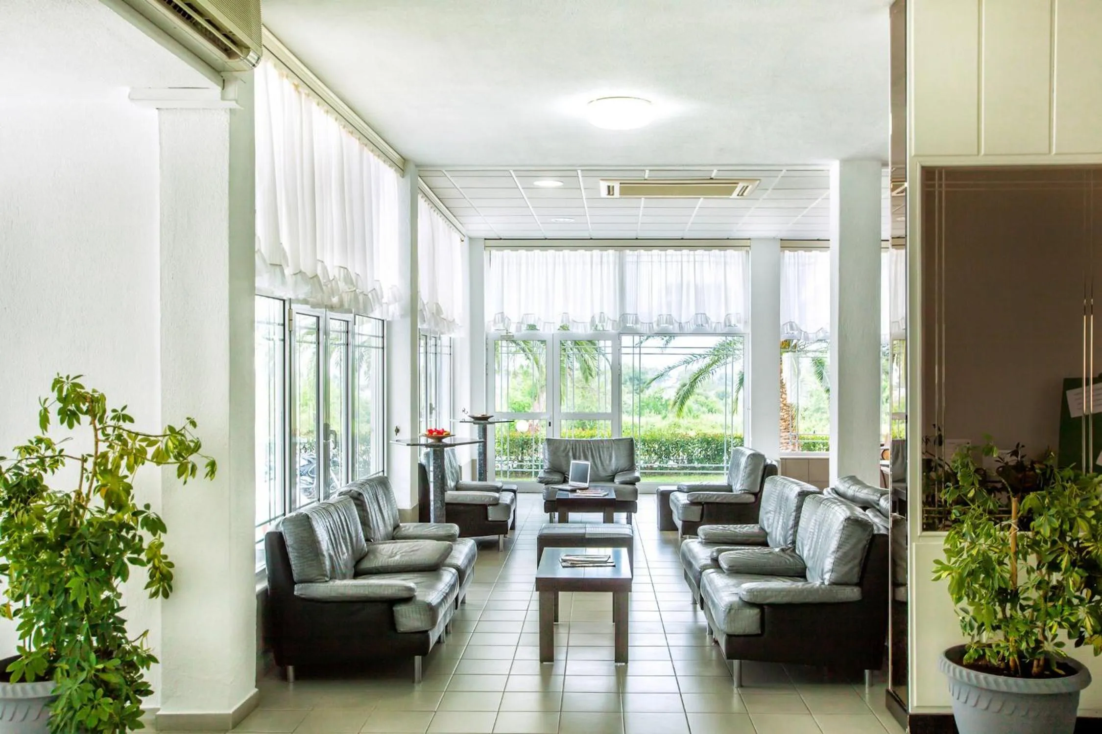 Lobby or reception in Xenios Port Marina Hotel