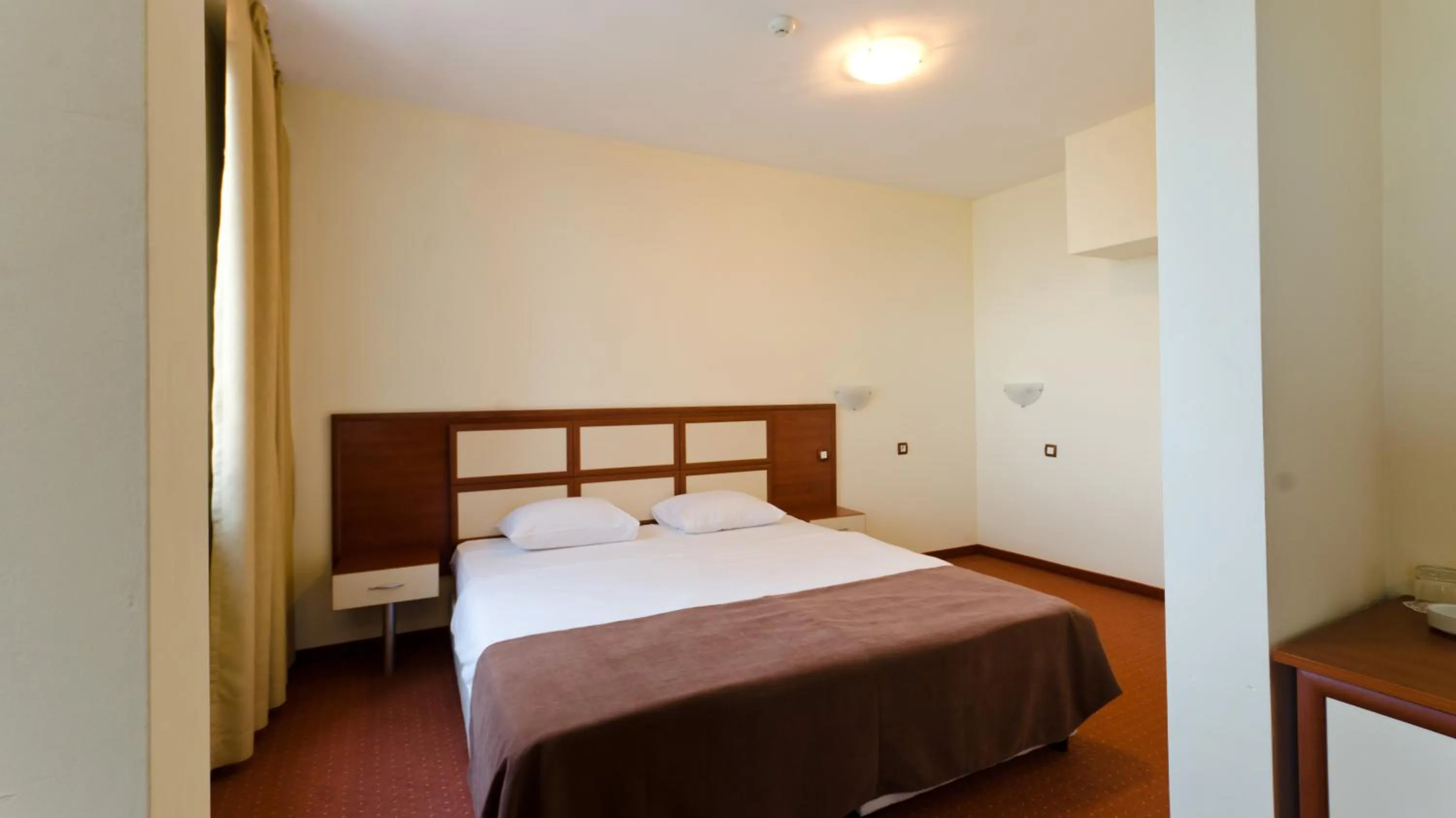 Bed in Nadejda Hotel