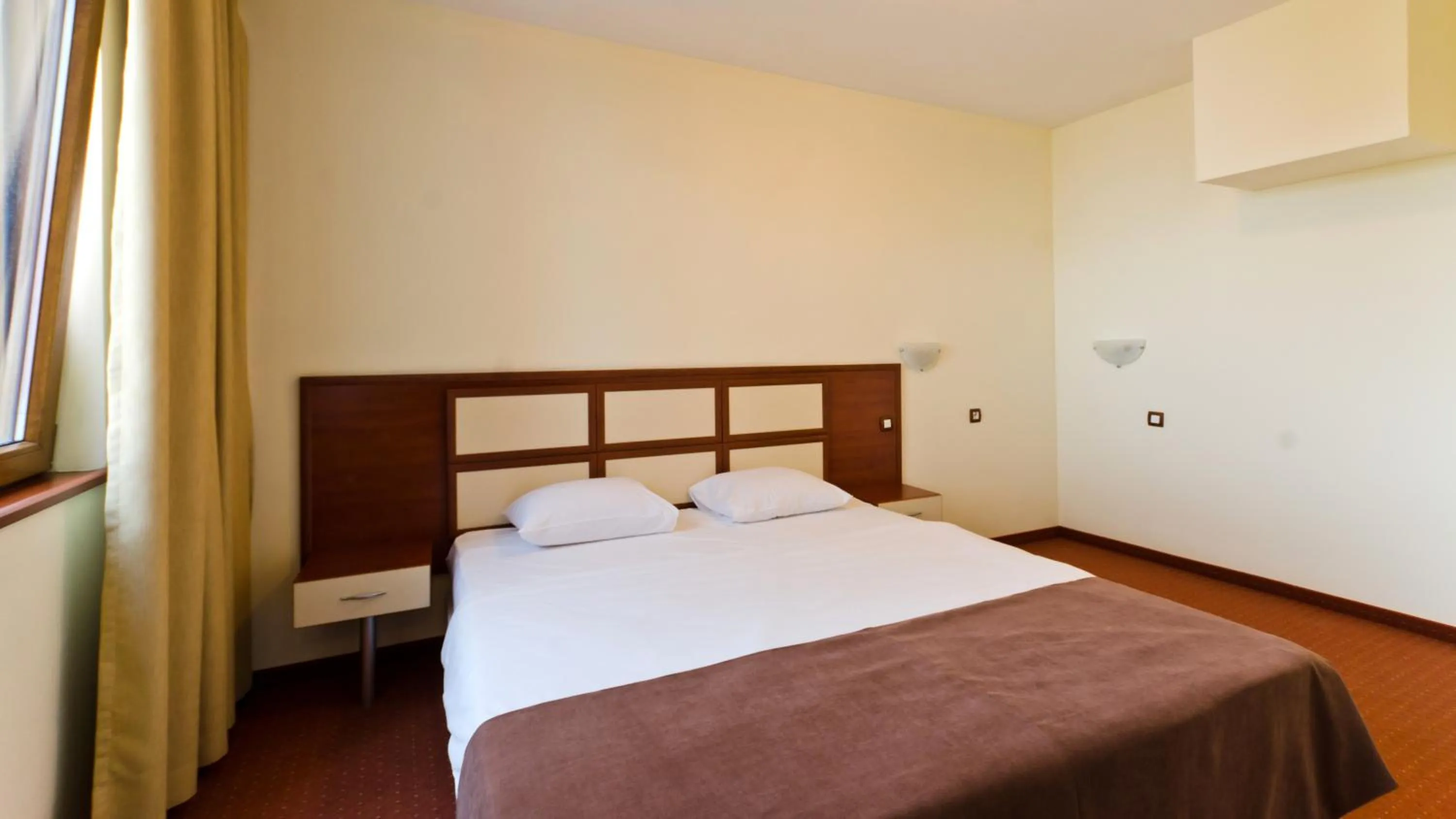 Bed in Nadejda Hotel