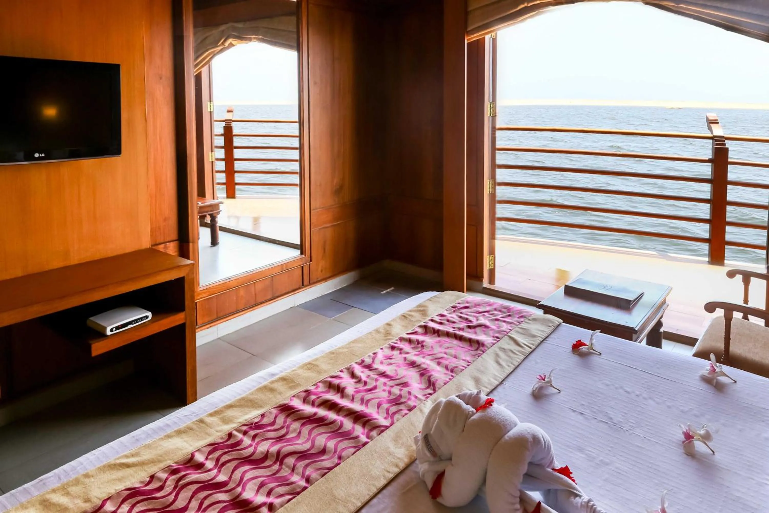Balcony/Terrace, Bed in Poovar Island Resort