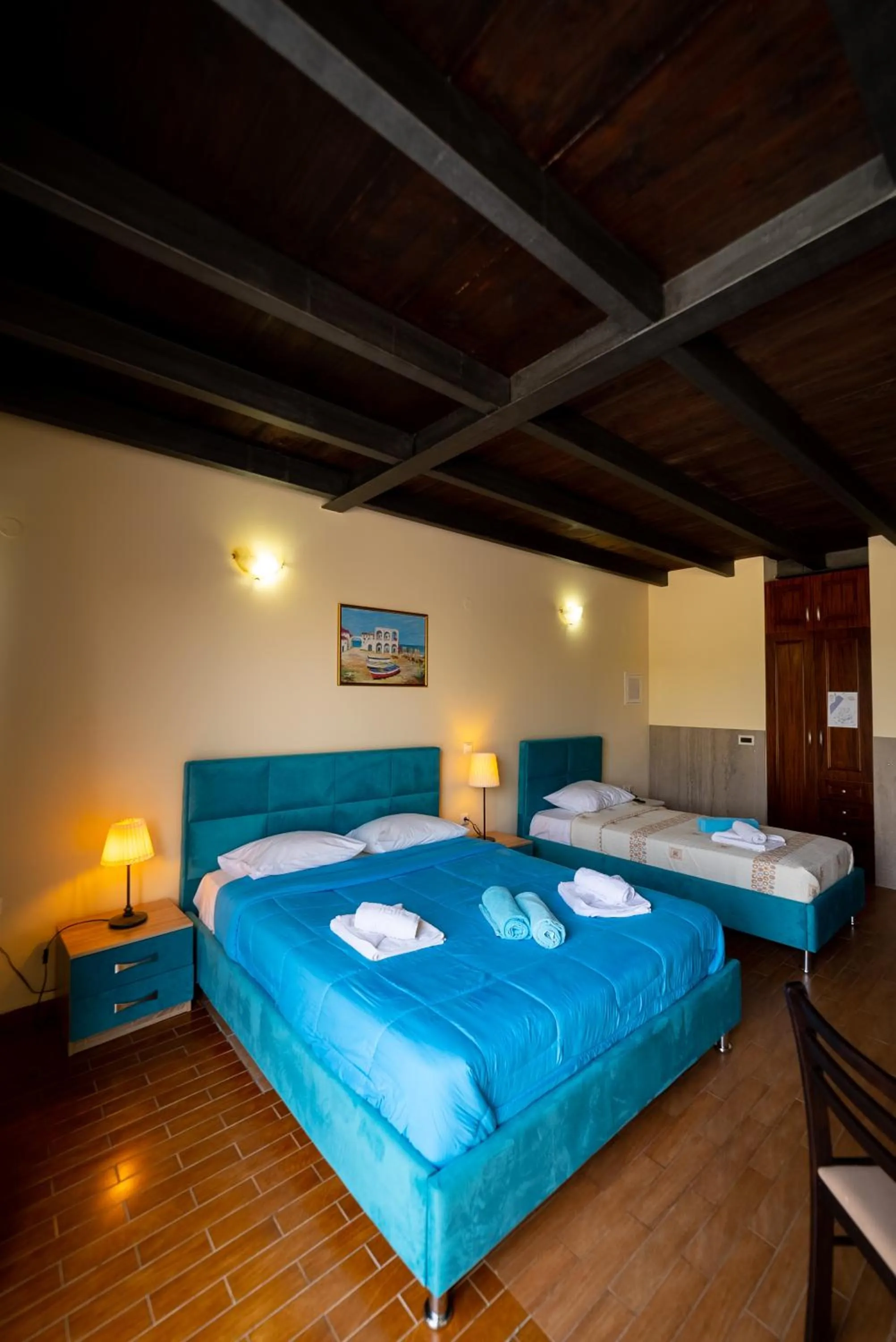 Bed in Ornella Beach Resort & Villas