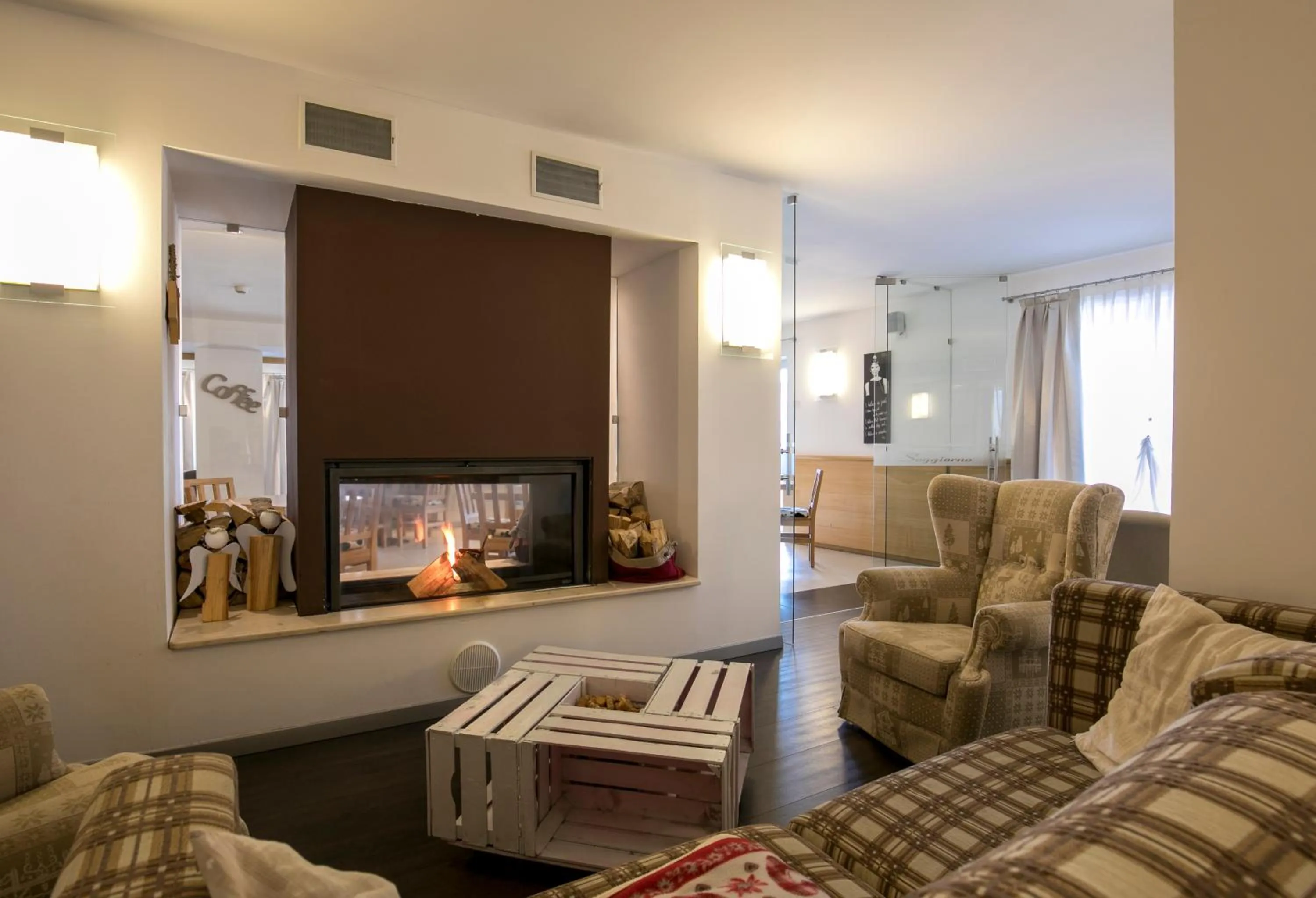 Communal lounge/ TV room in Hotel Luna Bianca Folgaria