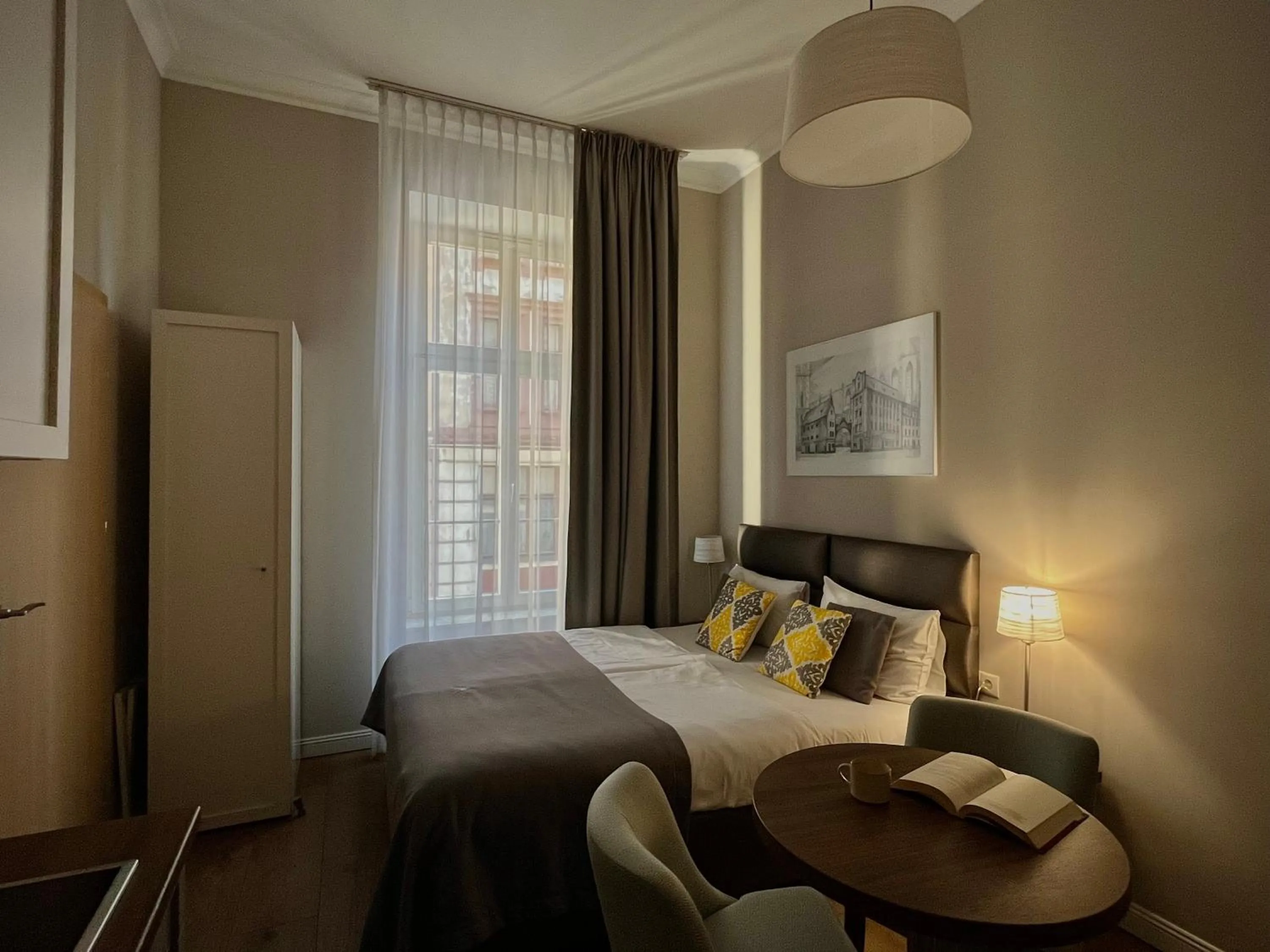 Bed in Joyinn Aparthotel