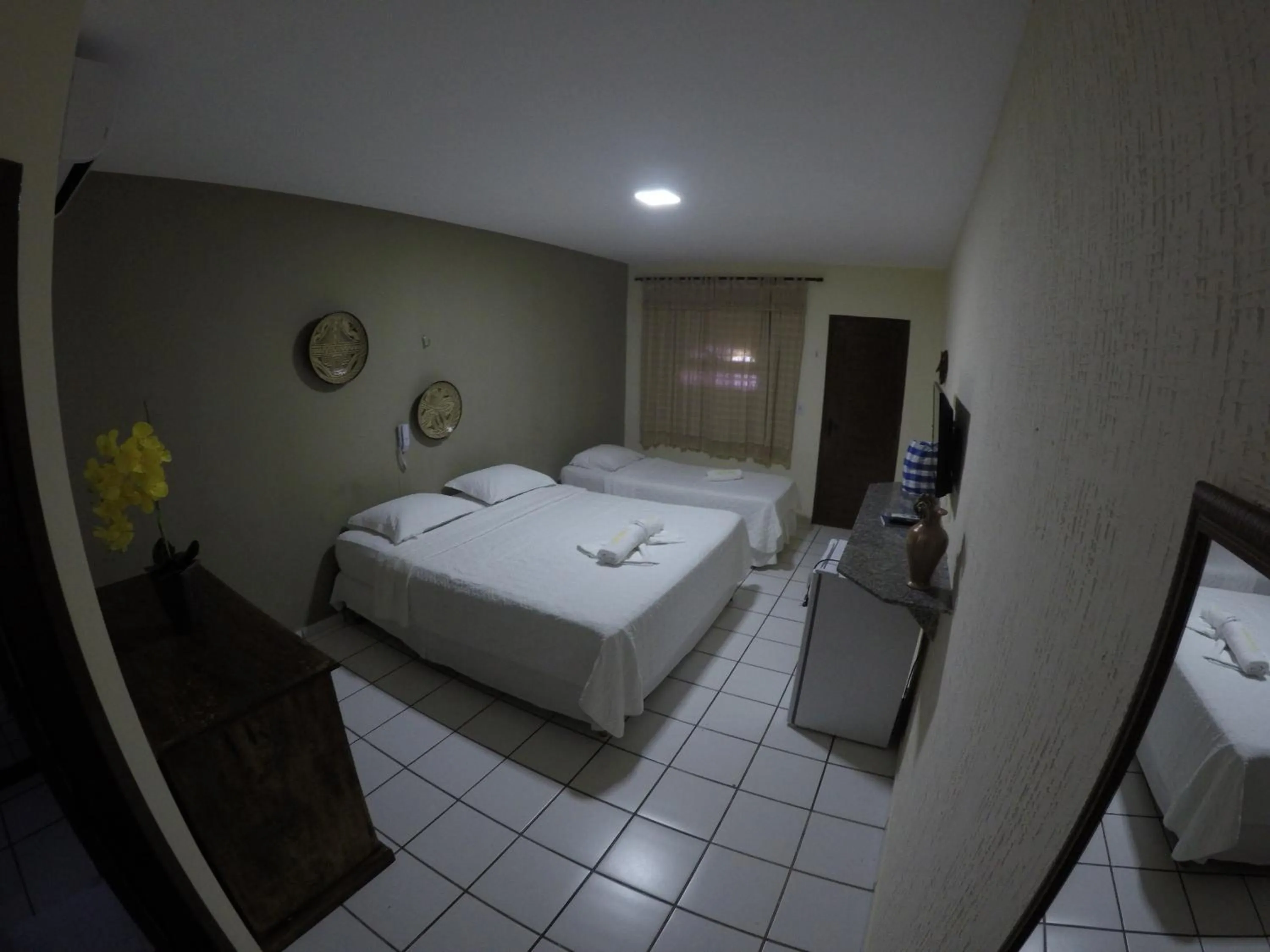 Bed in Pousada Enseada do Sol