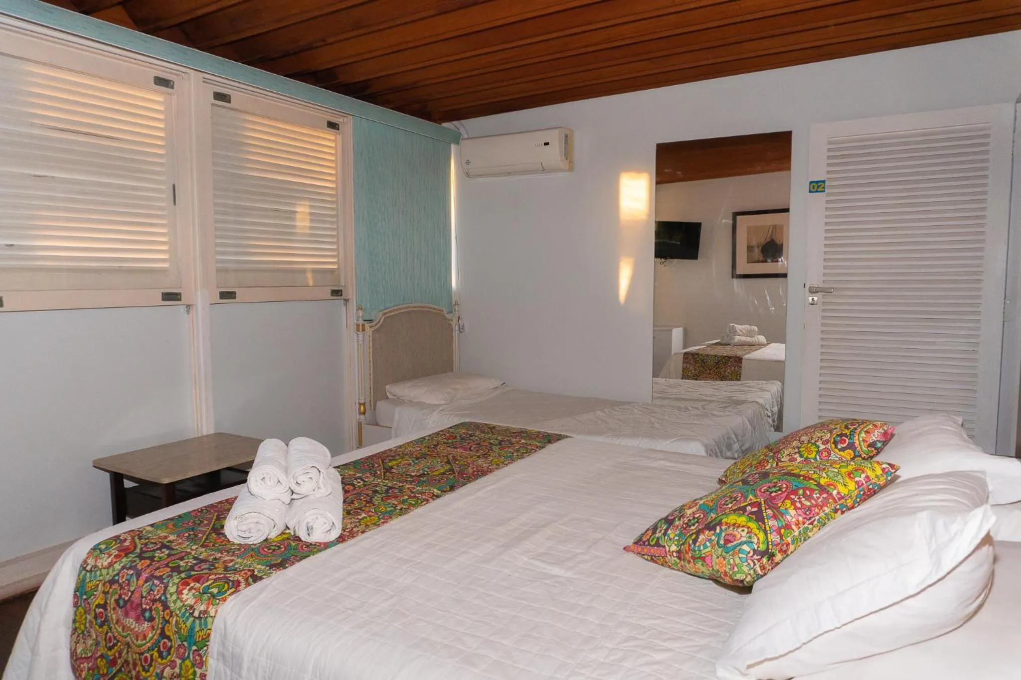 Bed in Pousada Marilia