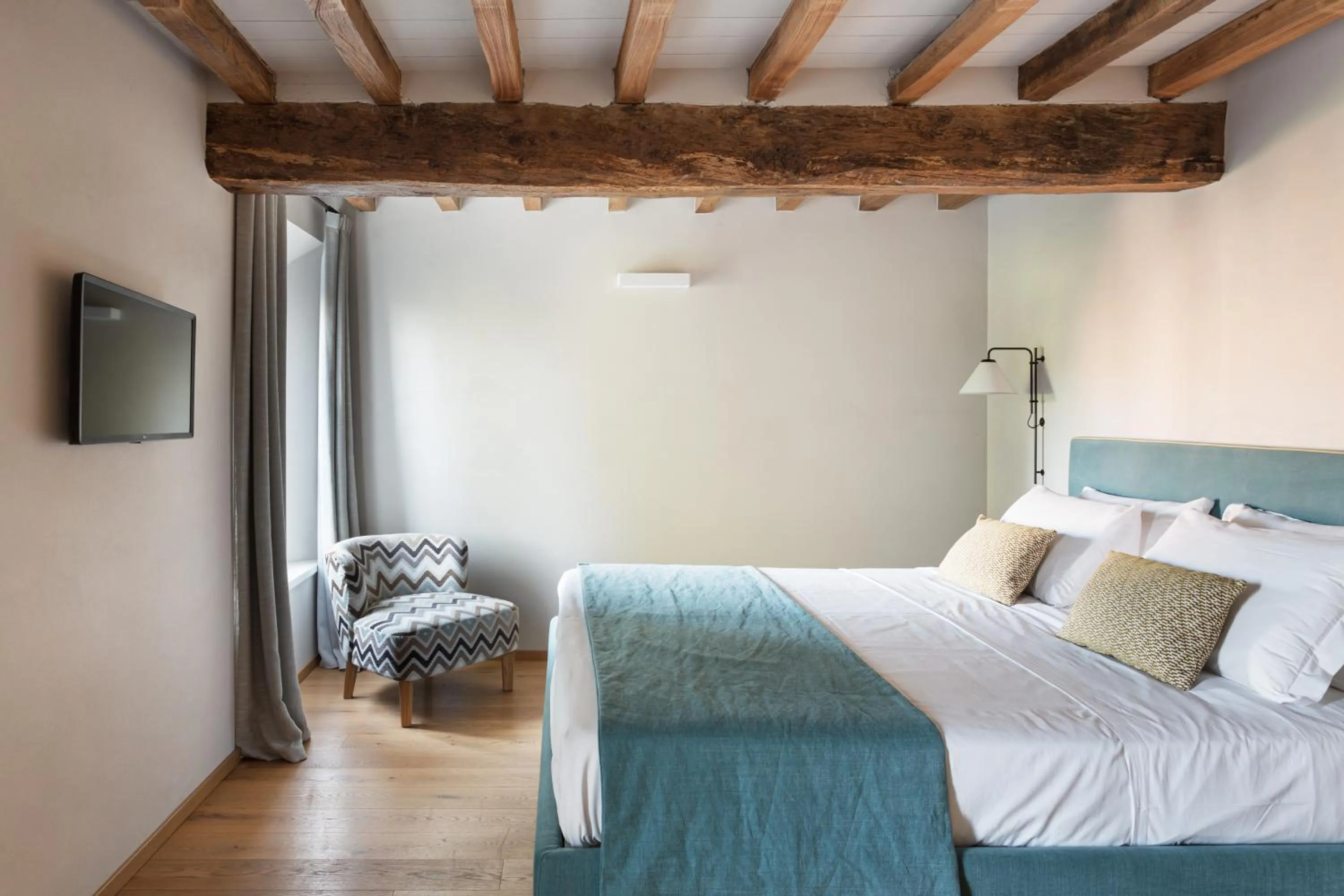 Bed in Relais Roncolo 1888 - Small Luxury Hotels of the World
