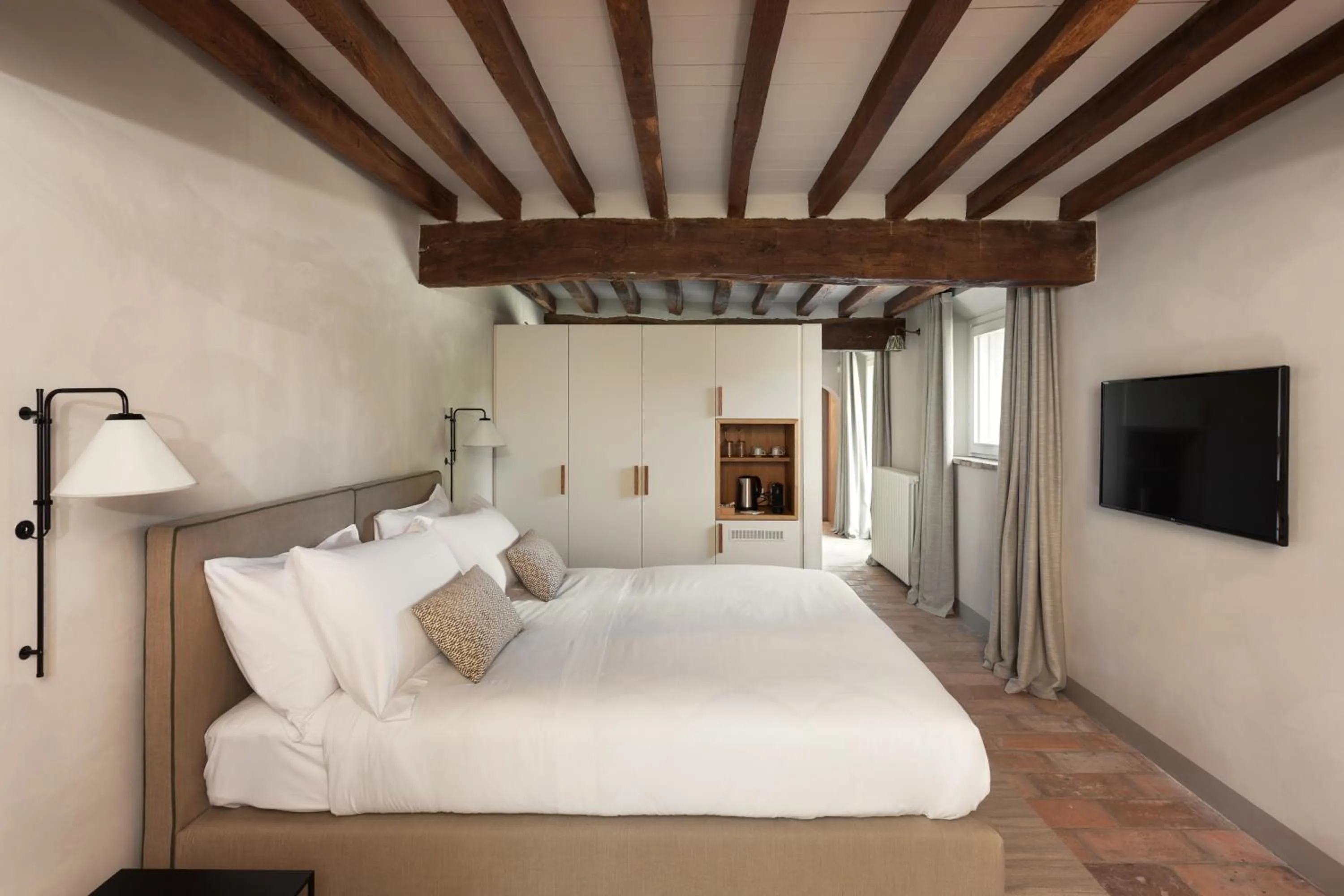 Bed in Relais Roncolo 1888 - Small Luxury Hotels of the World