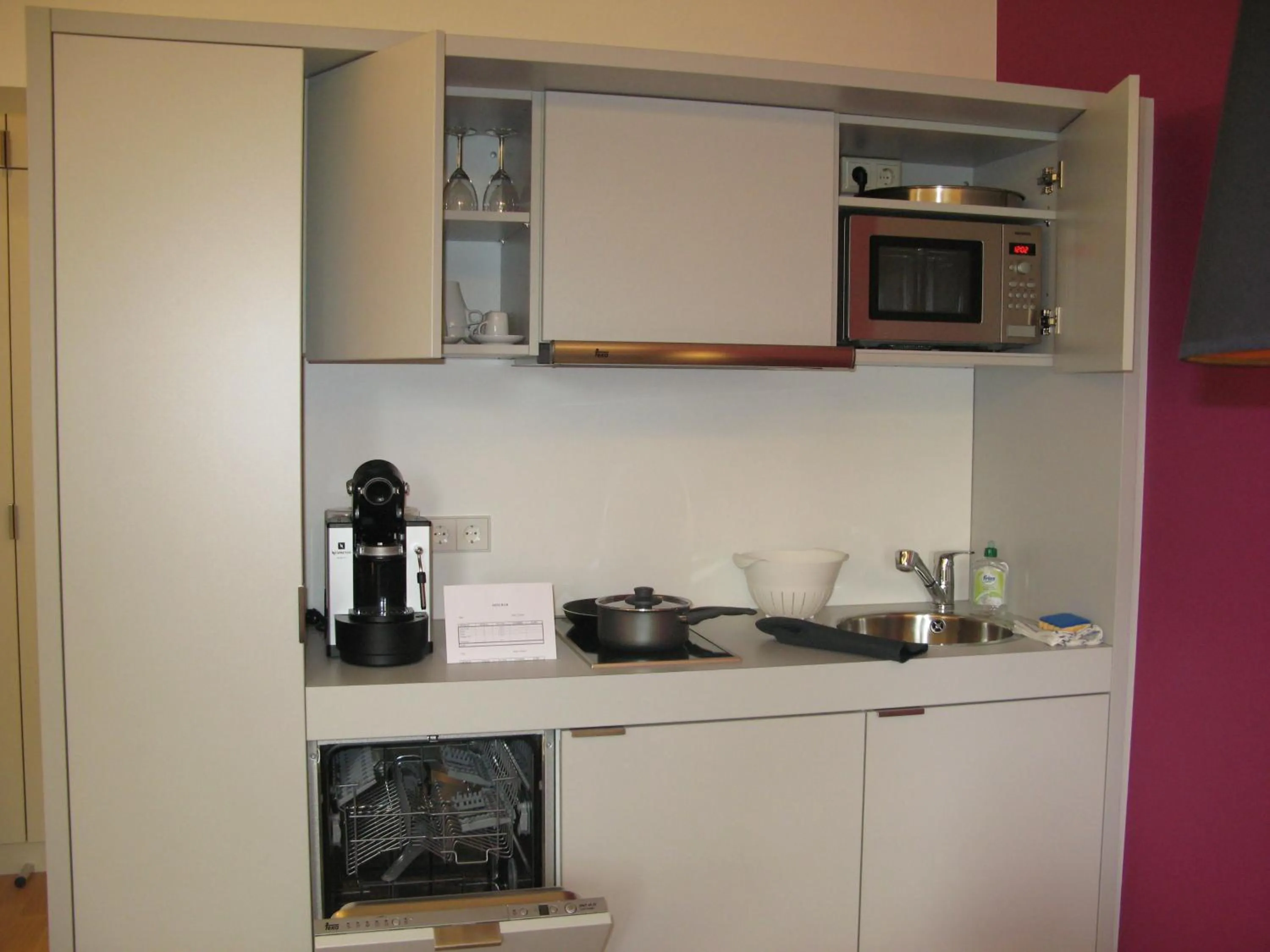 Kitchen or kitchenette in Key Inn Appart Hotel Parc de Merl
