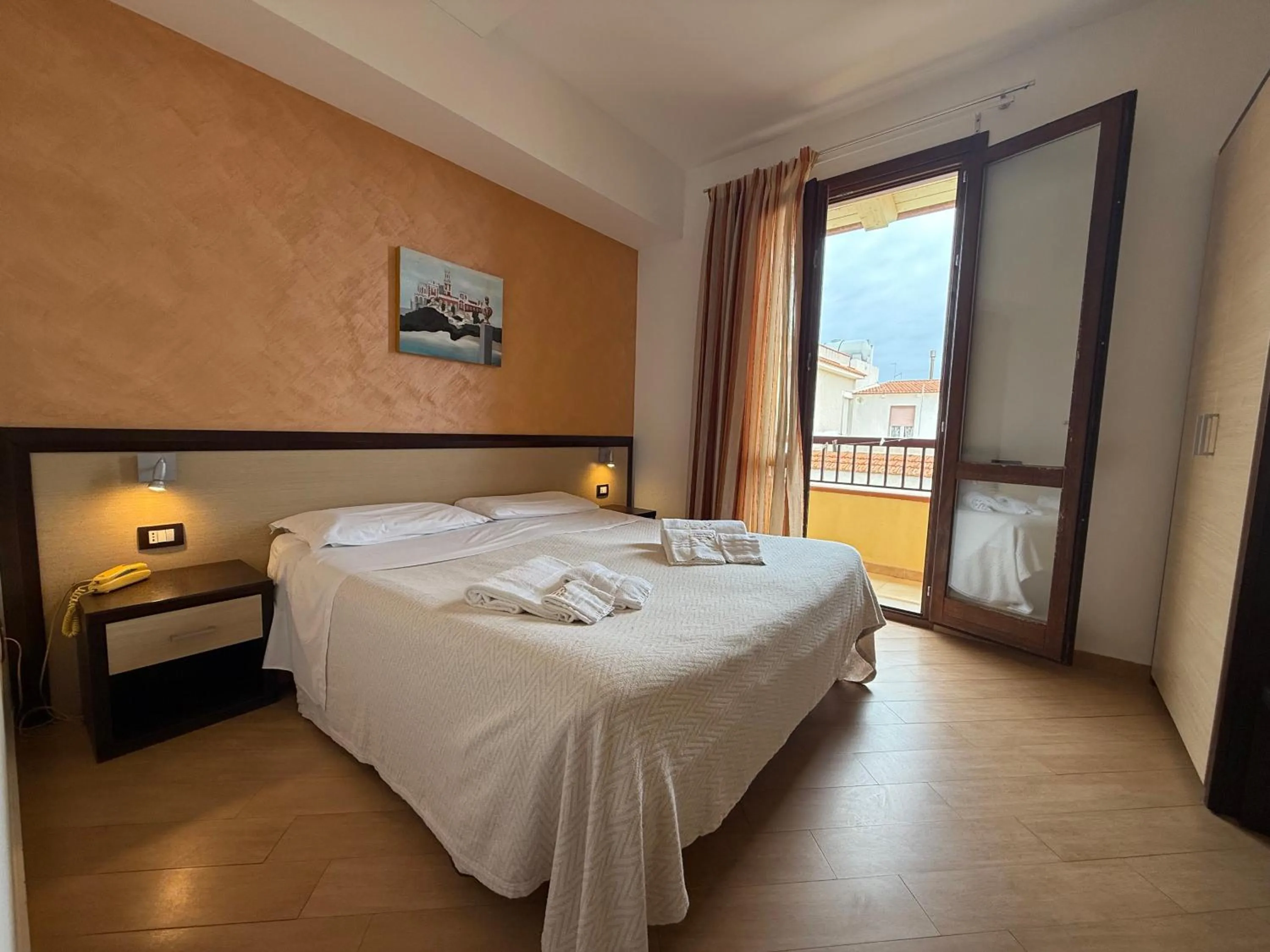 Bed in Albergo Perseo