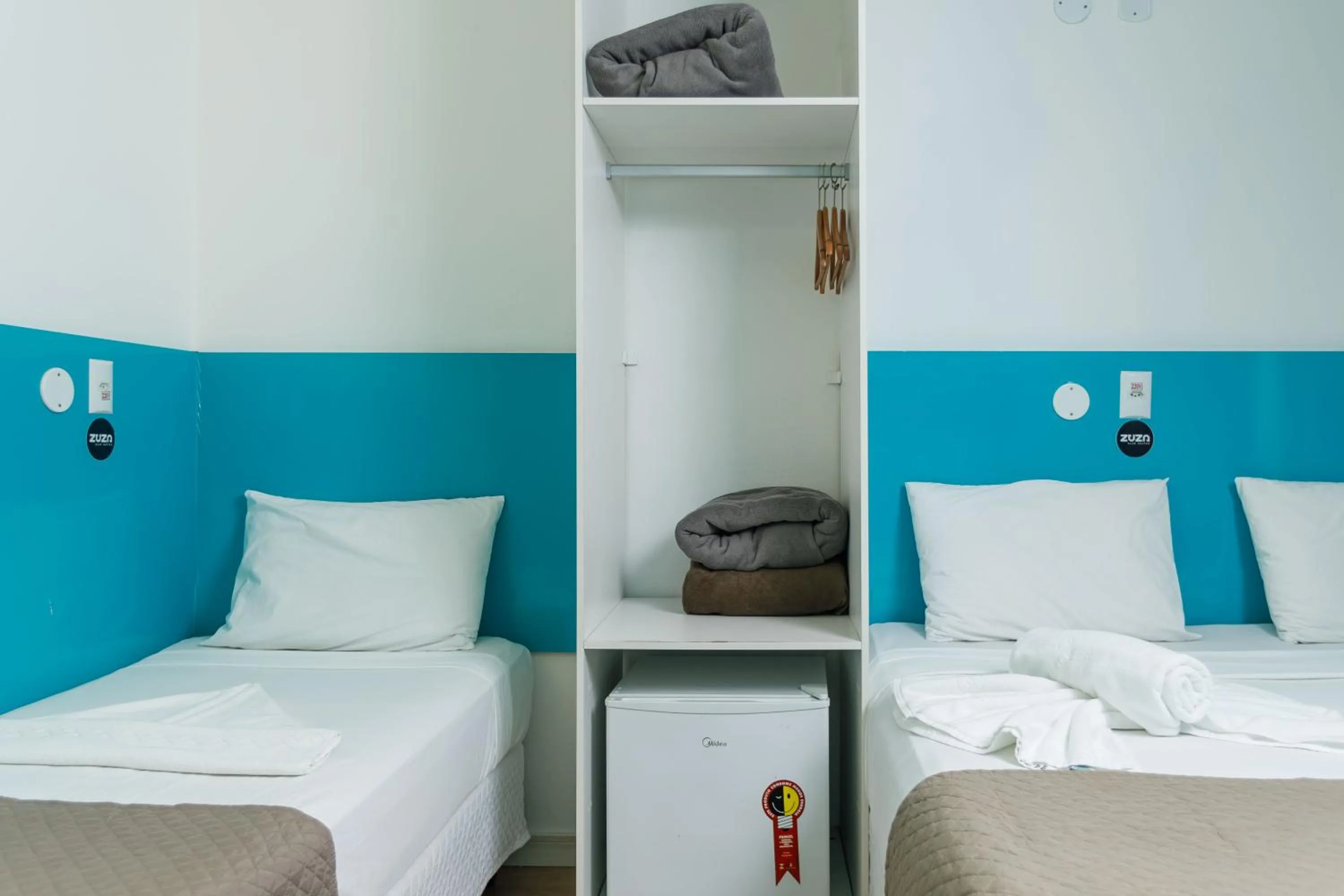 Bed in Zuza Slim Suítes