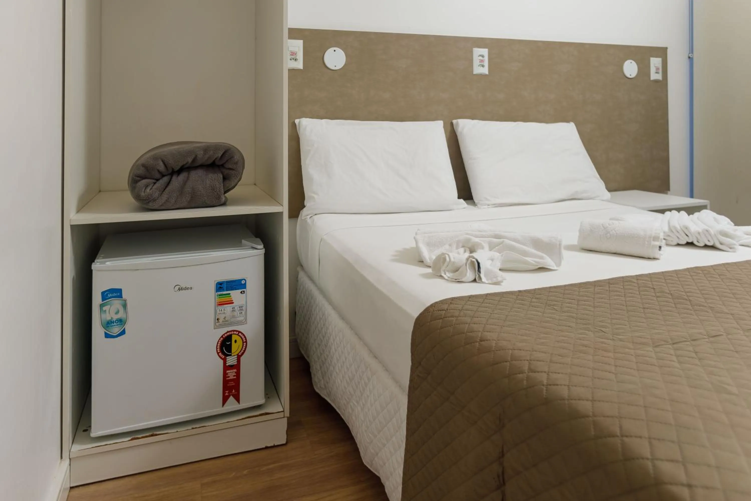 Bed in Zuza Slim Suítes