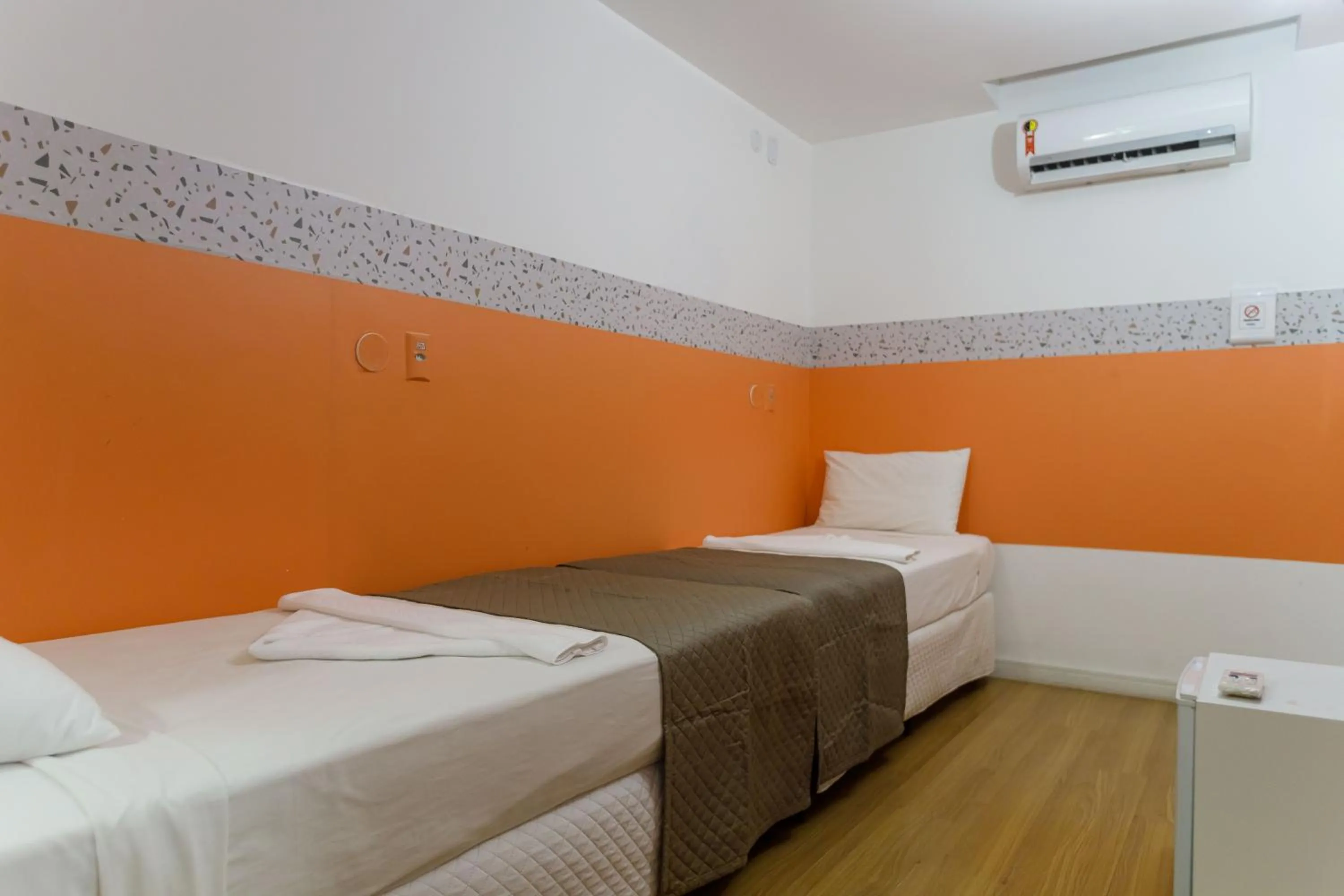 Bed in Zuza Slim Suítes