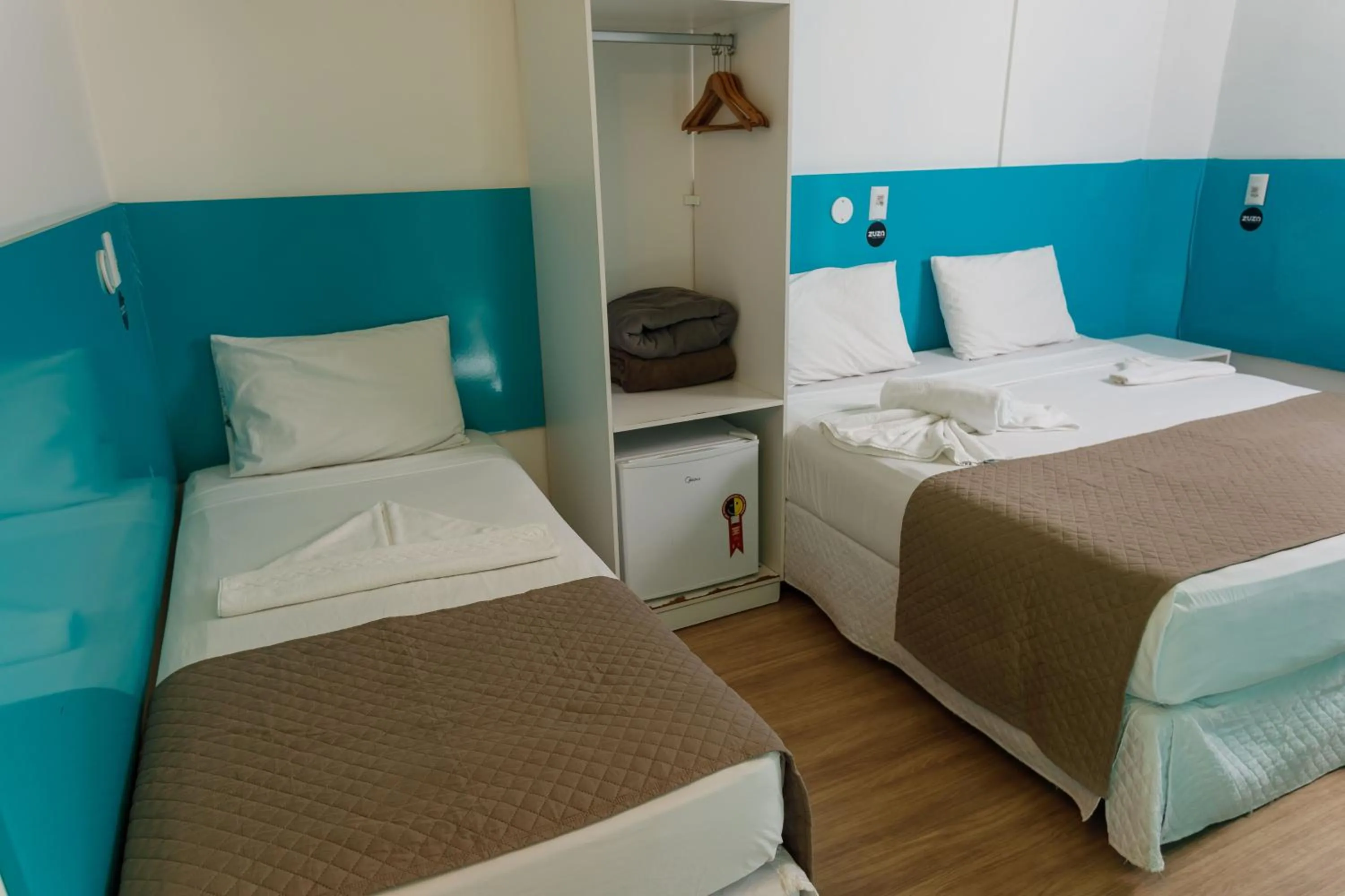 Bed in Zuza Slim Suítes