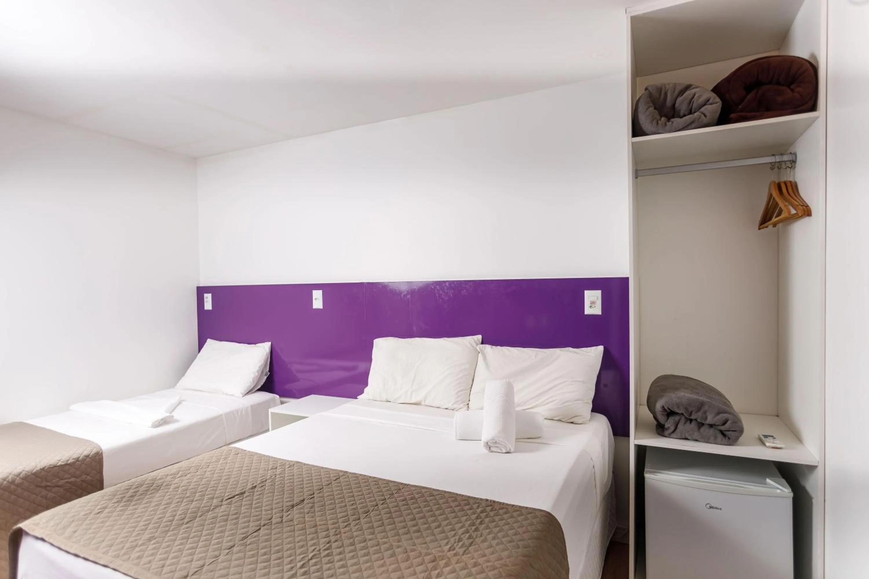 Bed in Zuza Slim Suítes