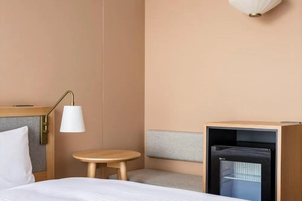 Photo of the whole room, Bed in RAKURO Kyoto by THE SHARE HOTELS