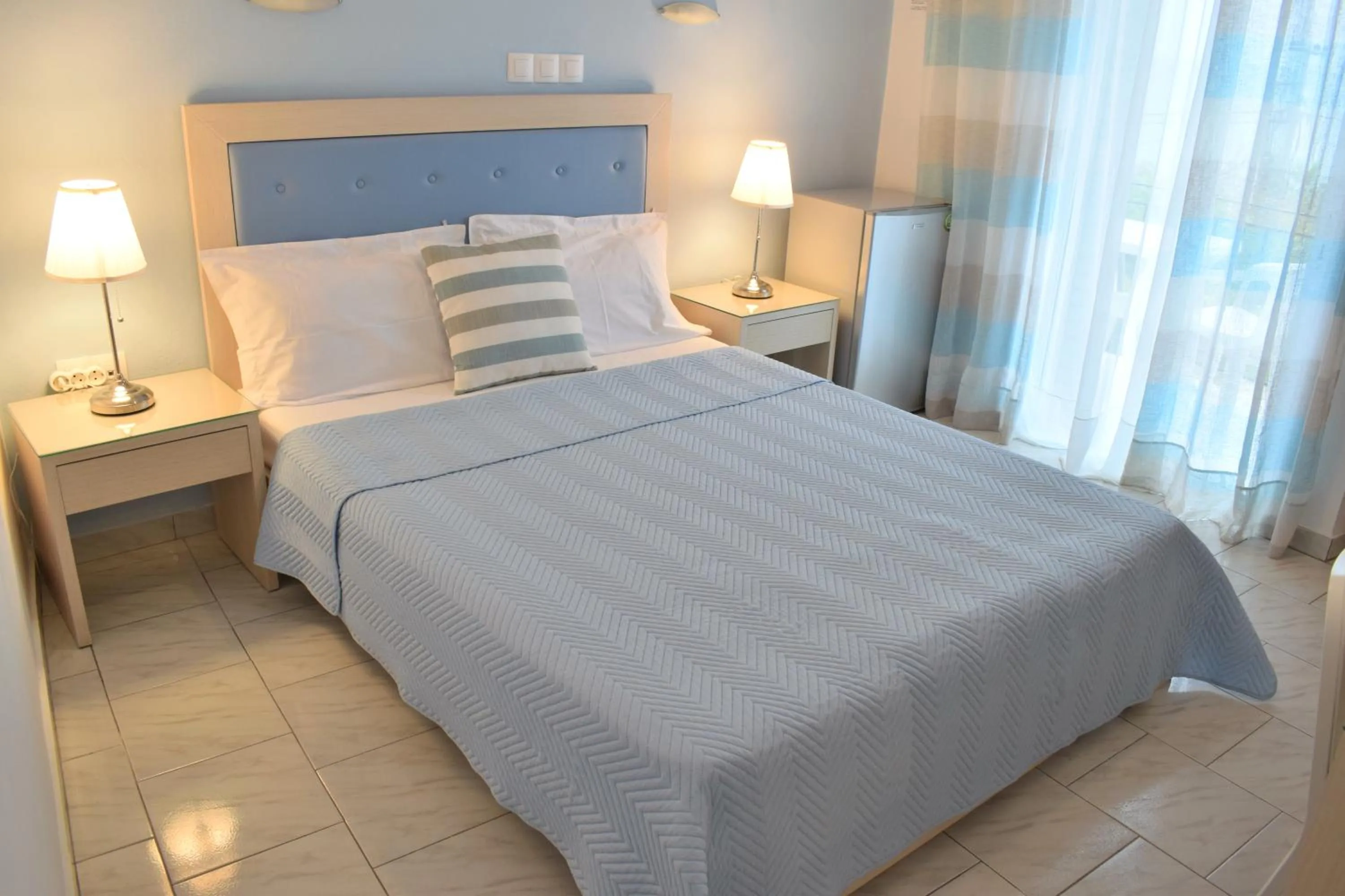 Bed in Mirto Beach Hotel & Restaurant