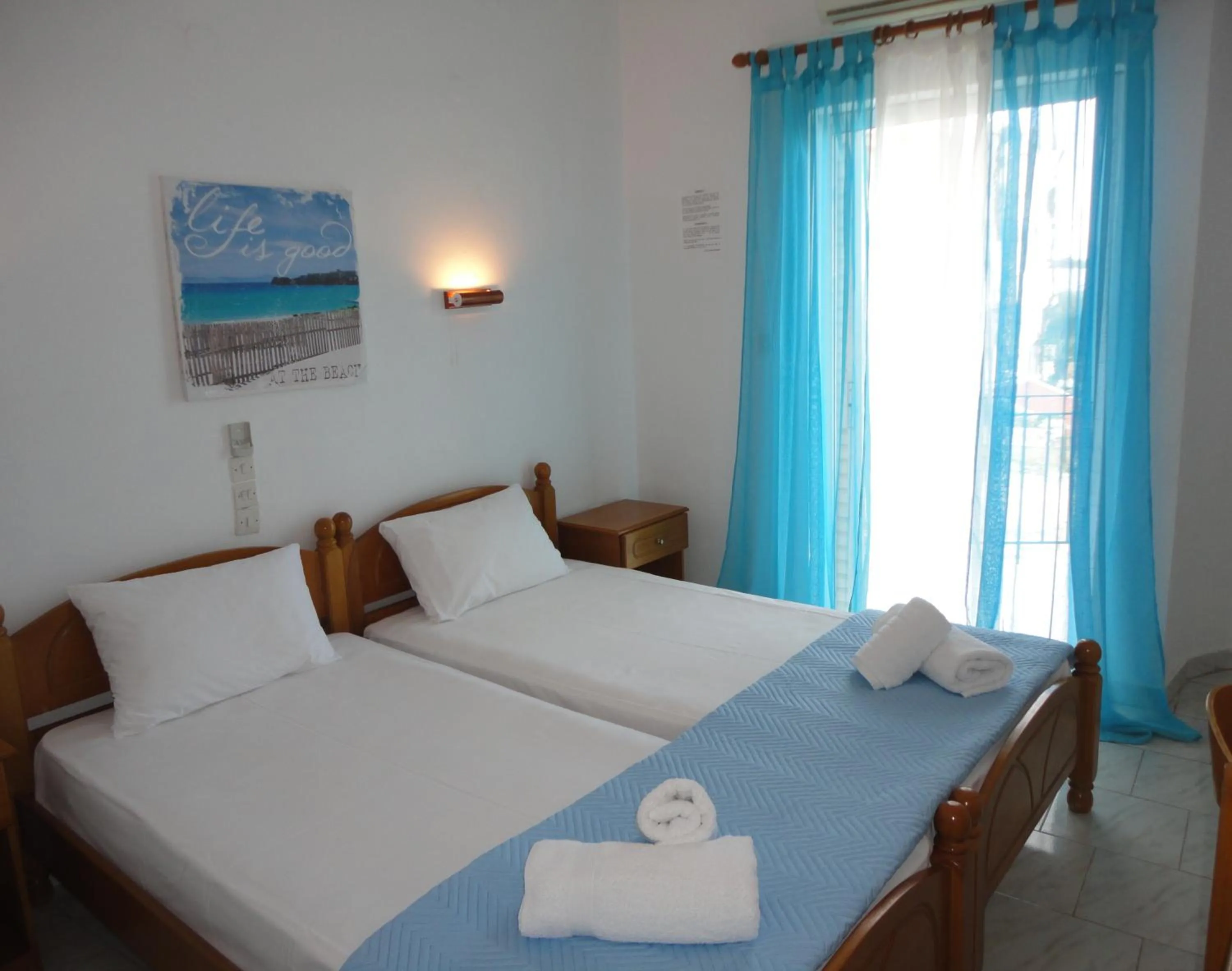 Bed in Mirto Beach Hotel & Restaurant