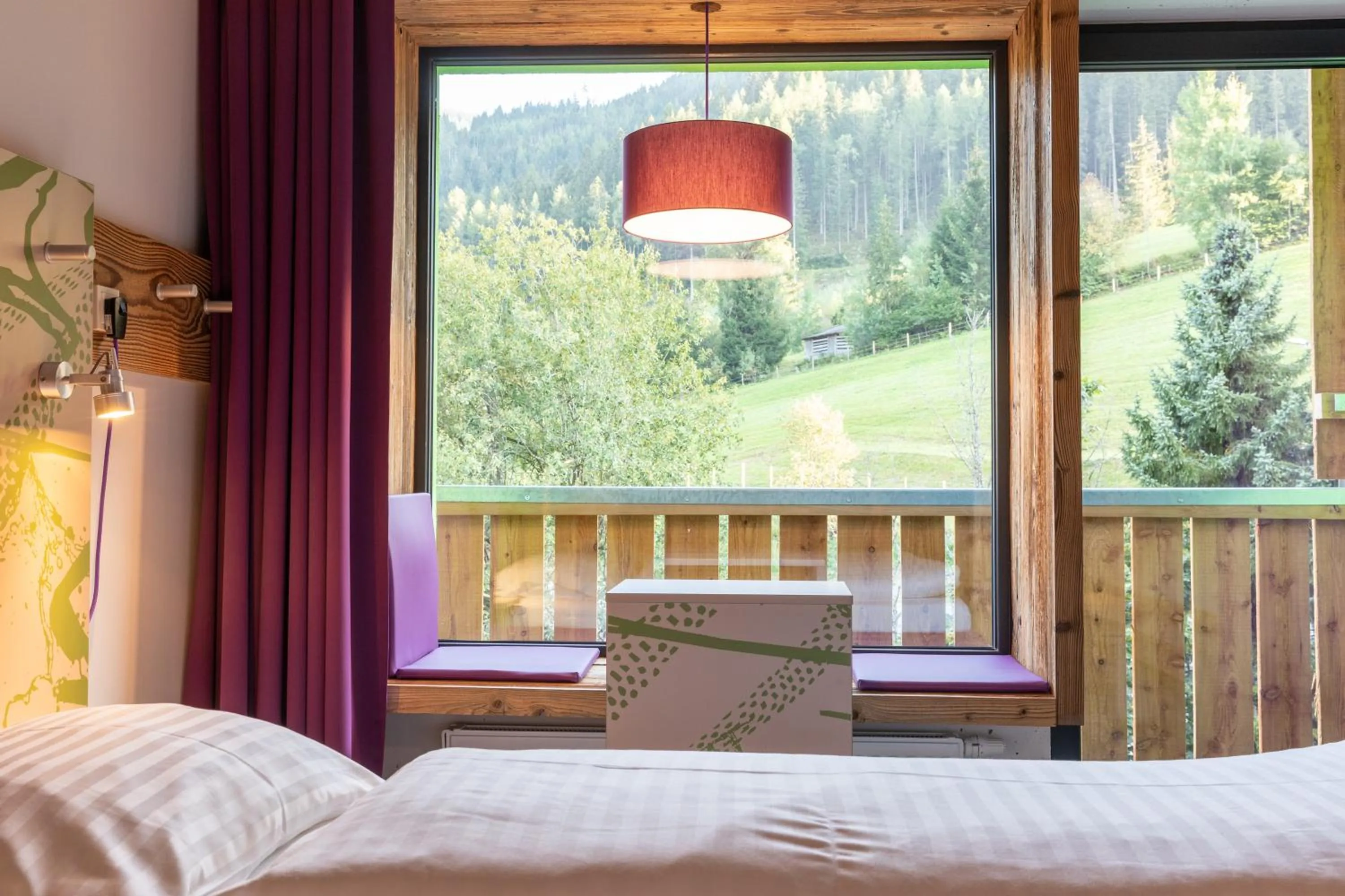 Living room, Bed in Explorer Hotel Montafon