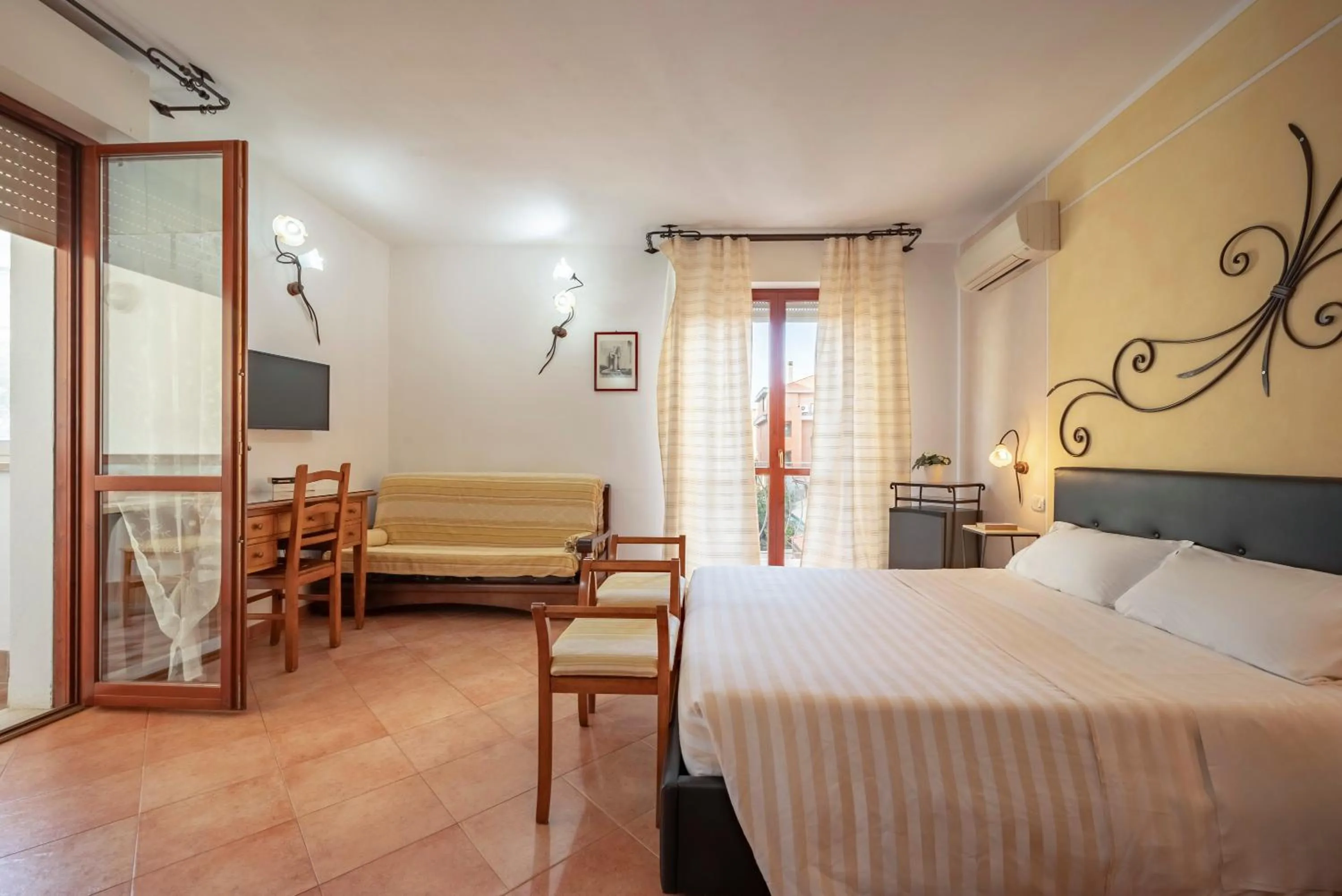 Bedroom in Lola Piccolo Hotel e Appartamenti