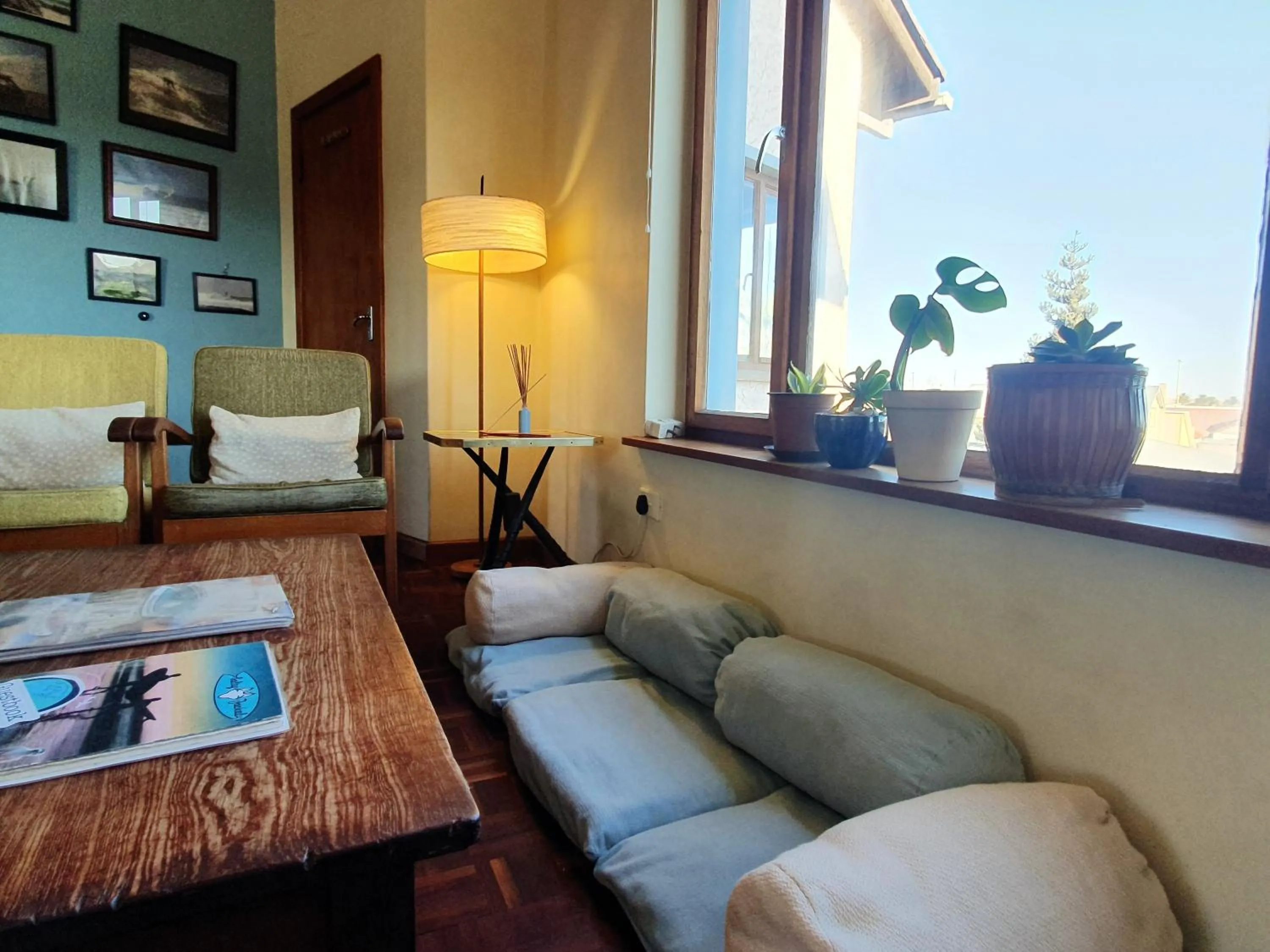 Communal lounge/ TV room in Salty Jackal Surf Camp