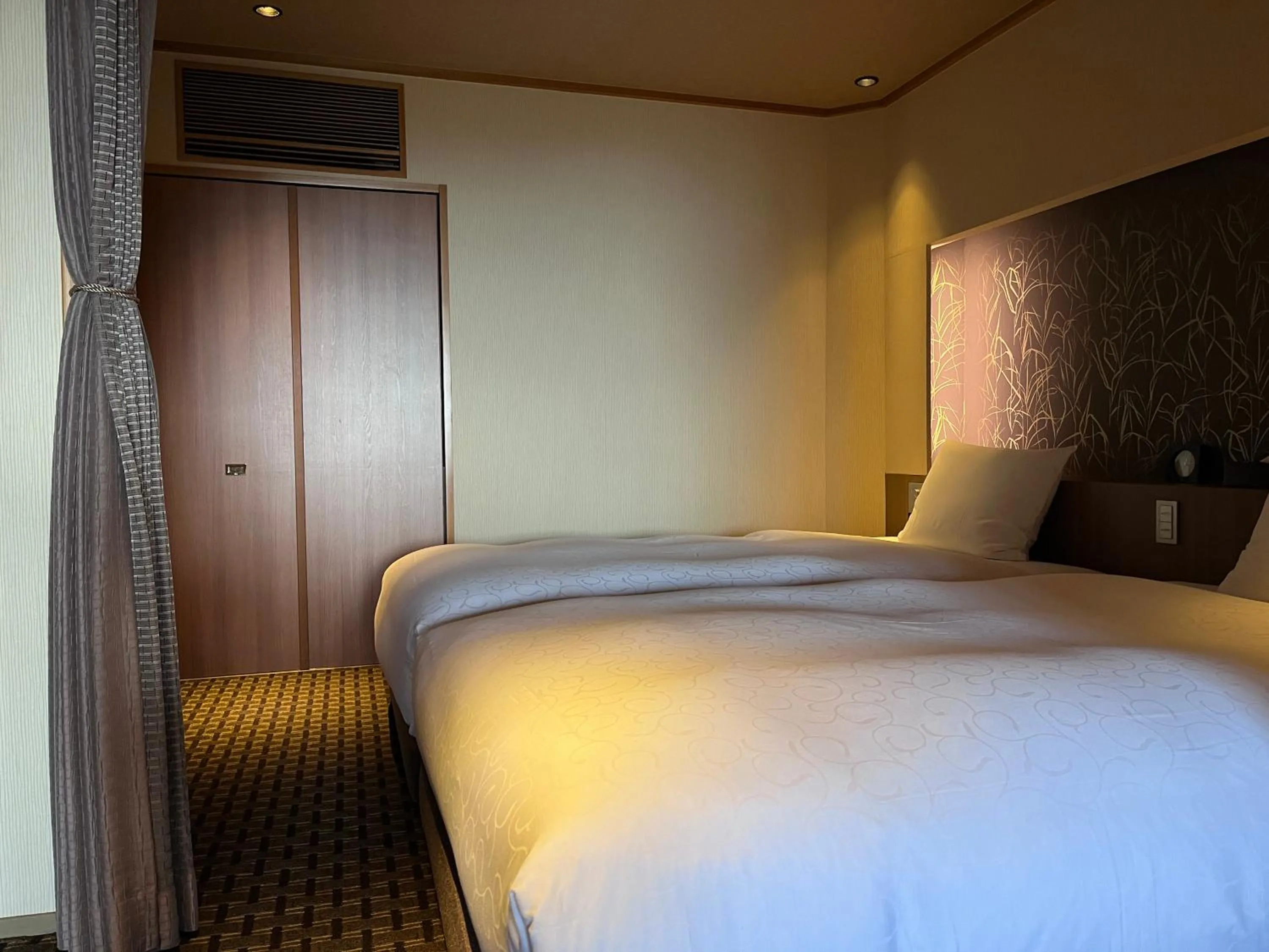 Bed in Laforet Shuzenji Sanshisuimei