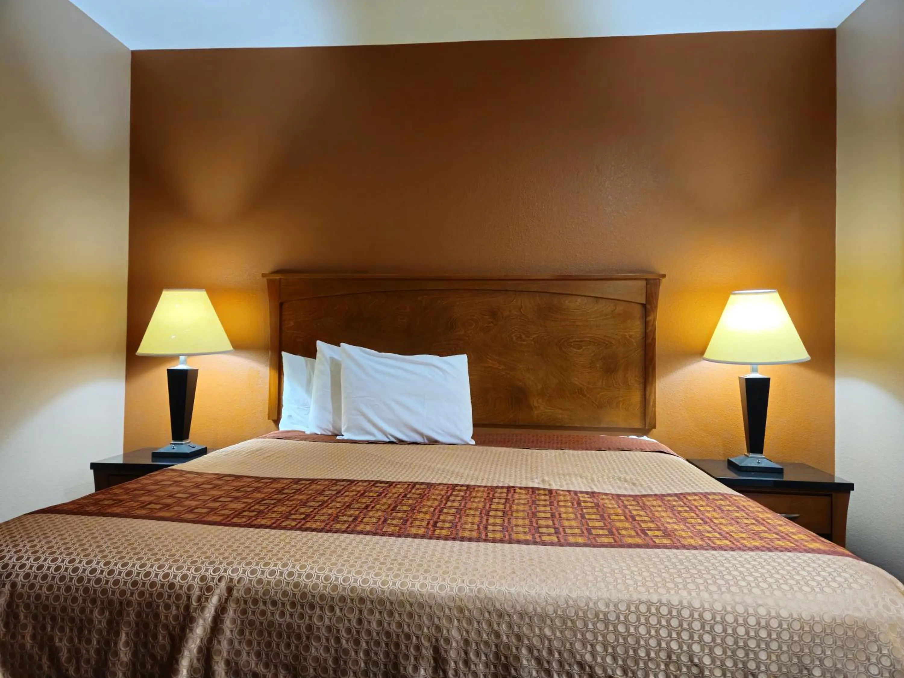 Bed in Budgetel Inn and Suites
