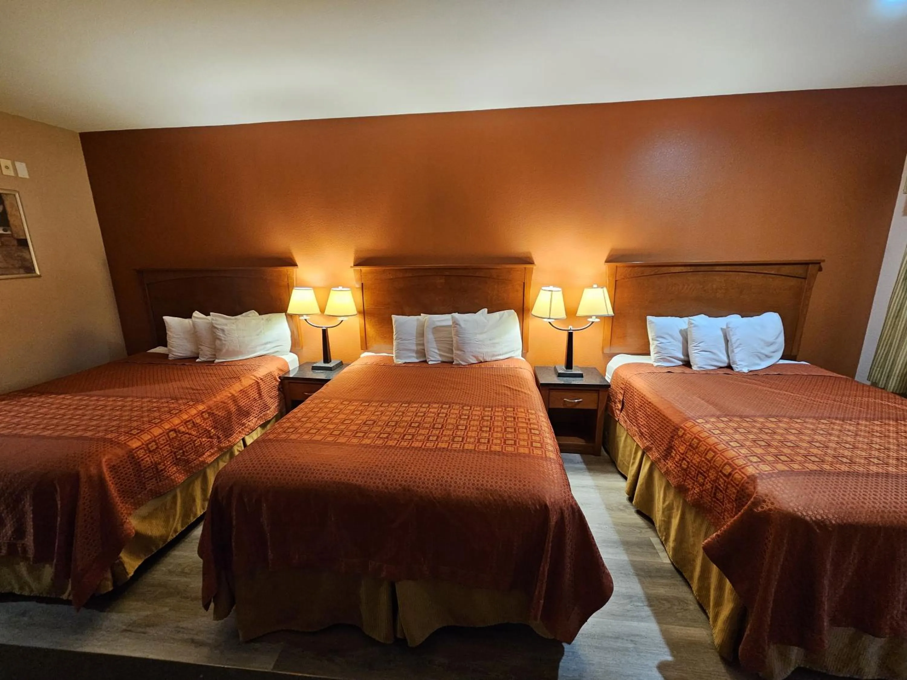 Bed in Budgetel Inn and Suites