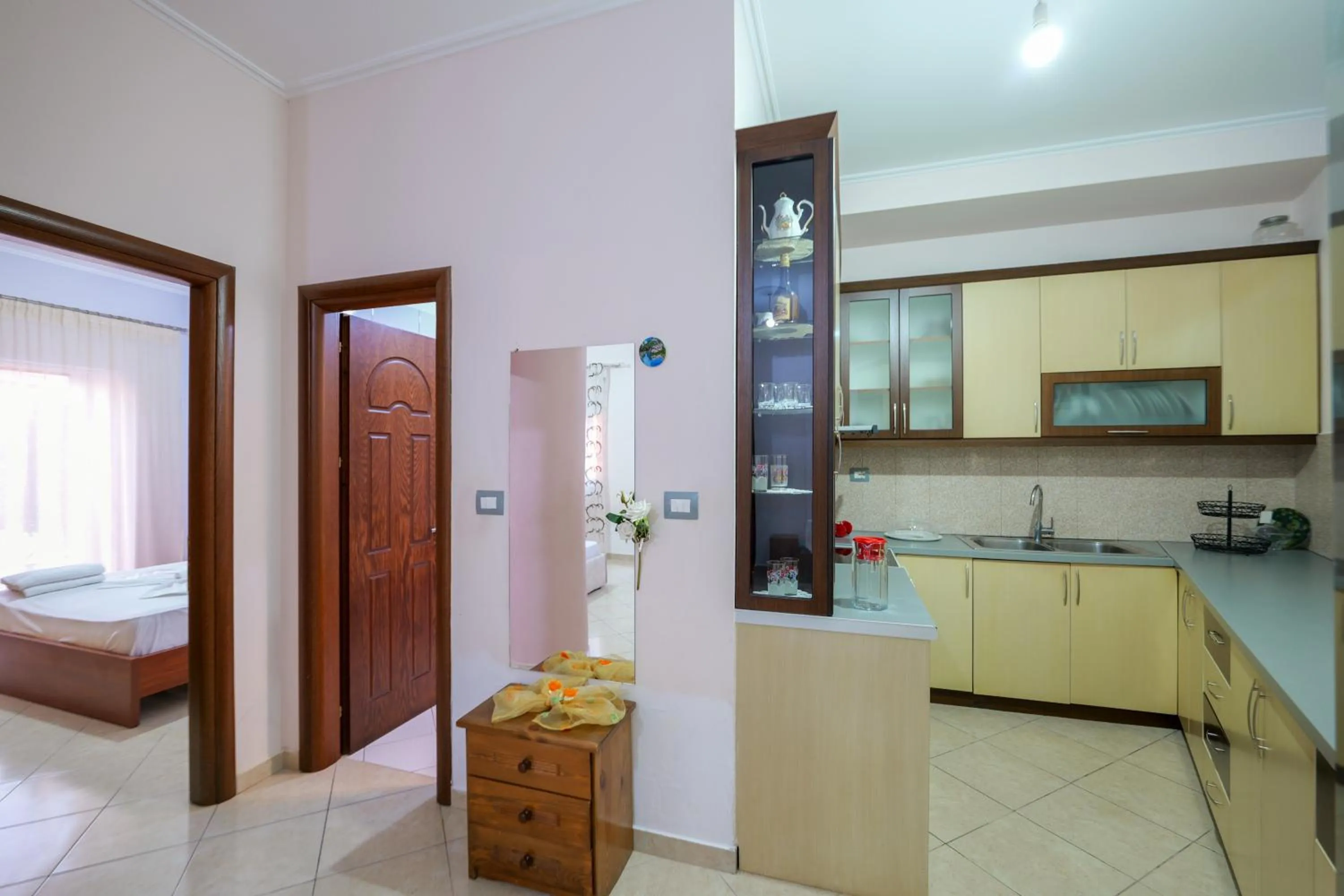 Kitchen or kitchenette, Bed in Unico ApartHotel