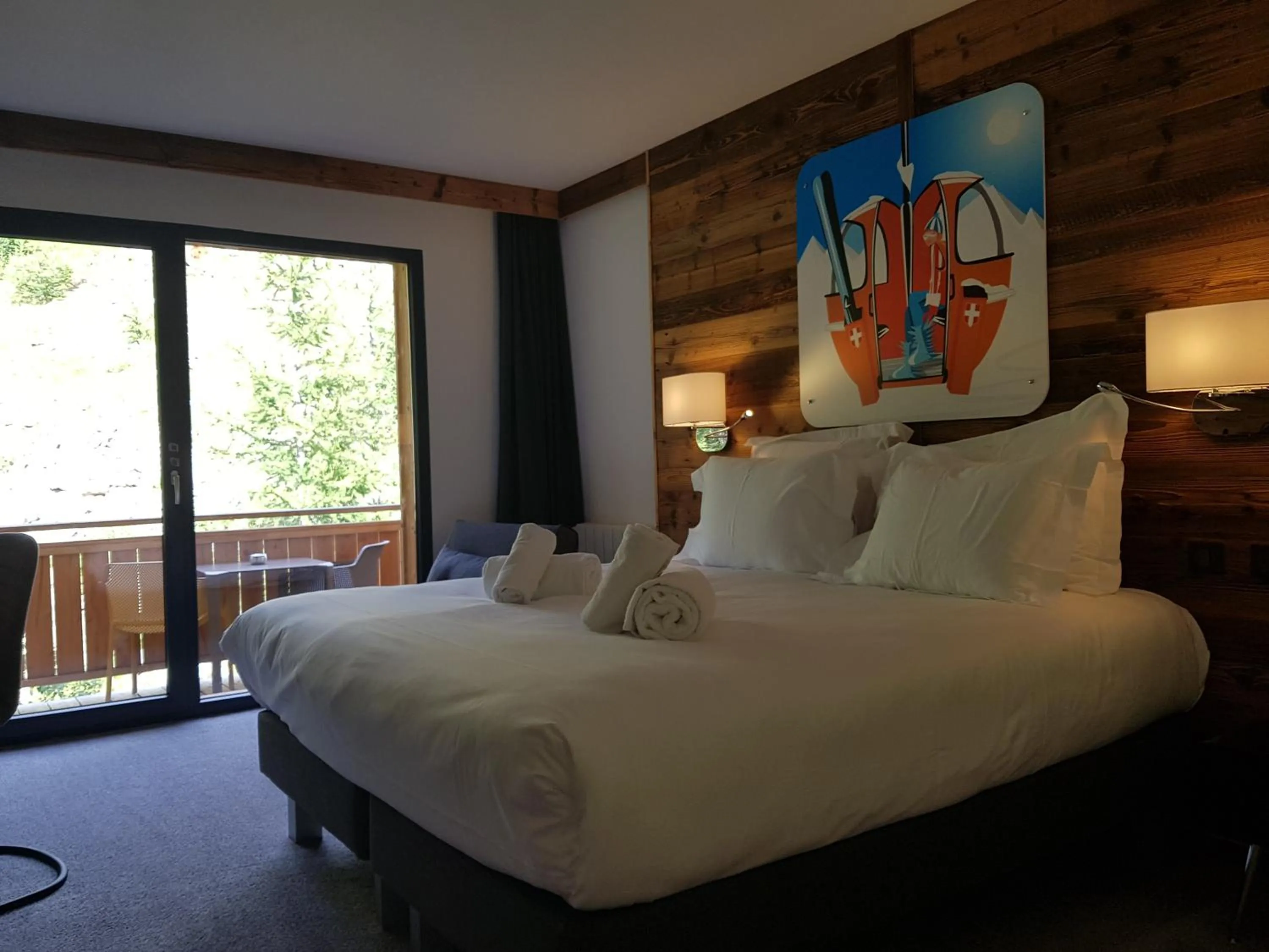 Bed in Chalet Marano Restaurant & Spa