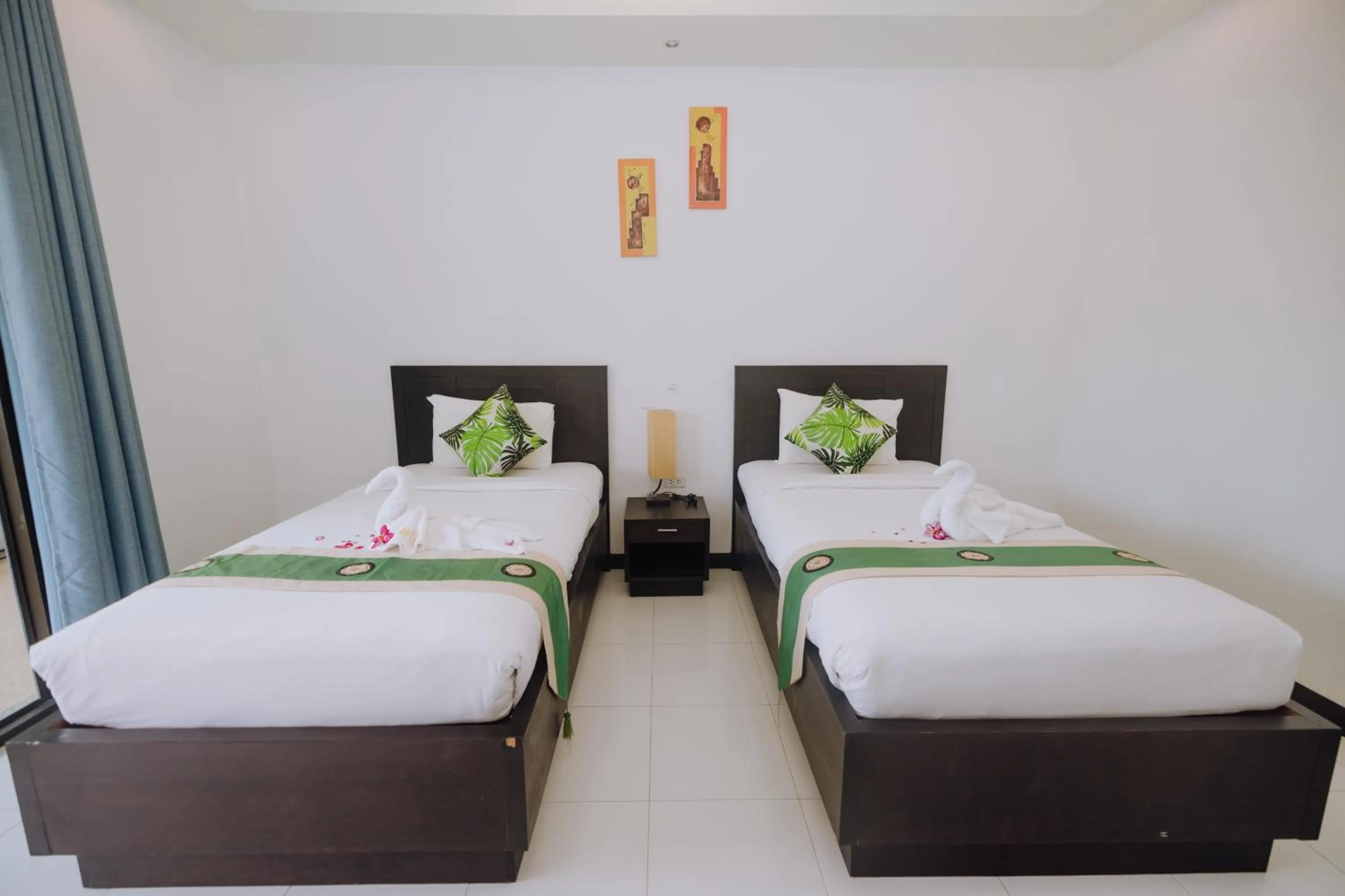 Bed in Phuket Monaburi Boutique Hotel