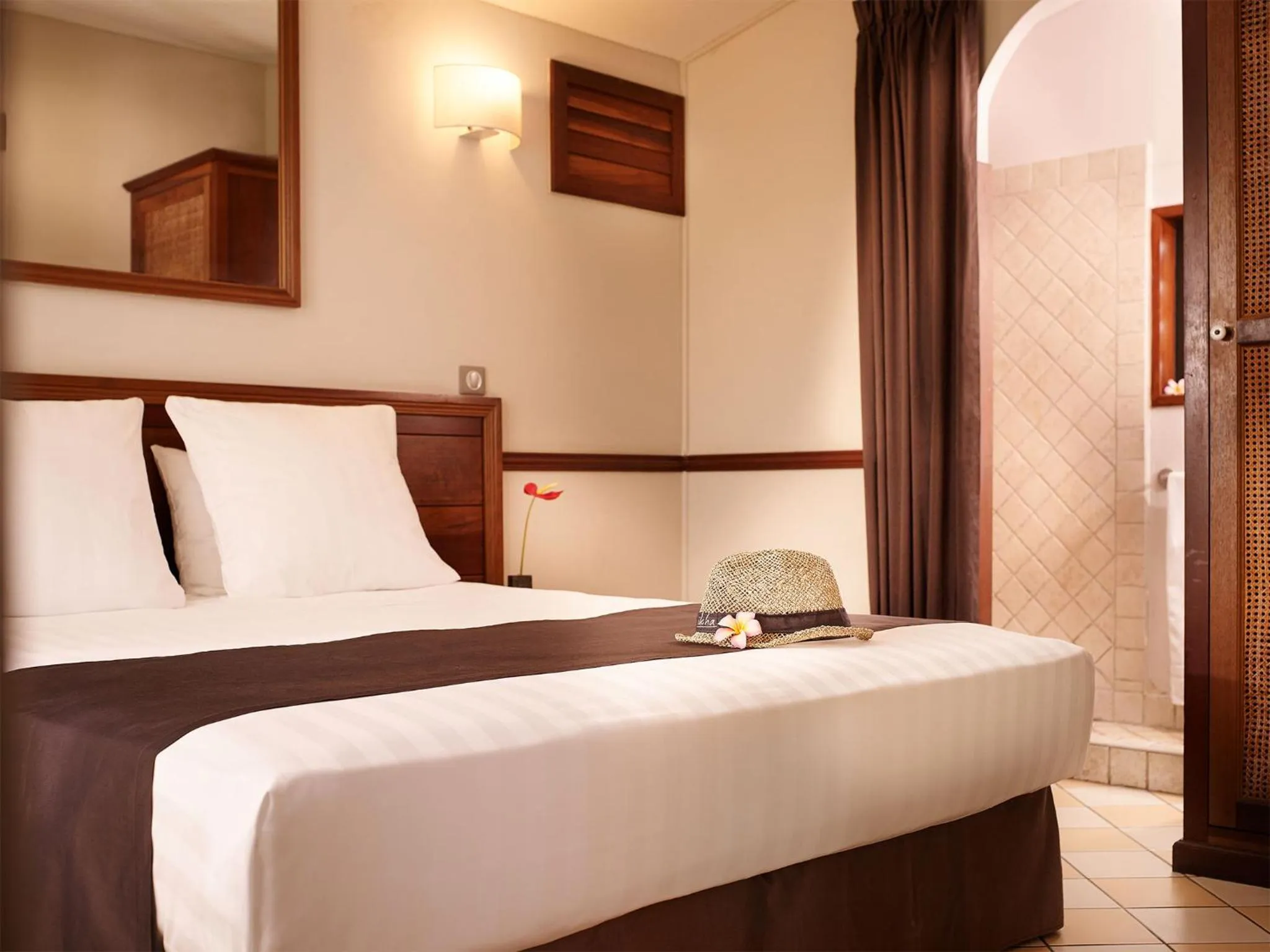 Bed in Iloha Seaview Hotel