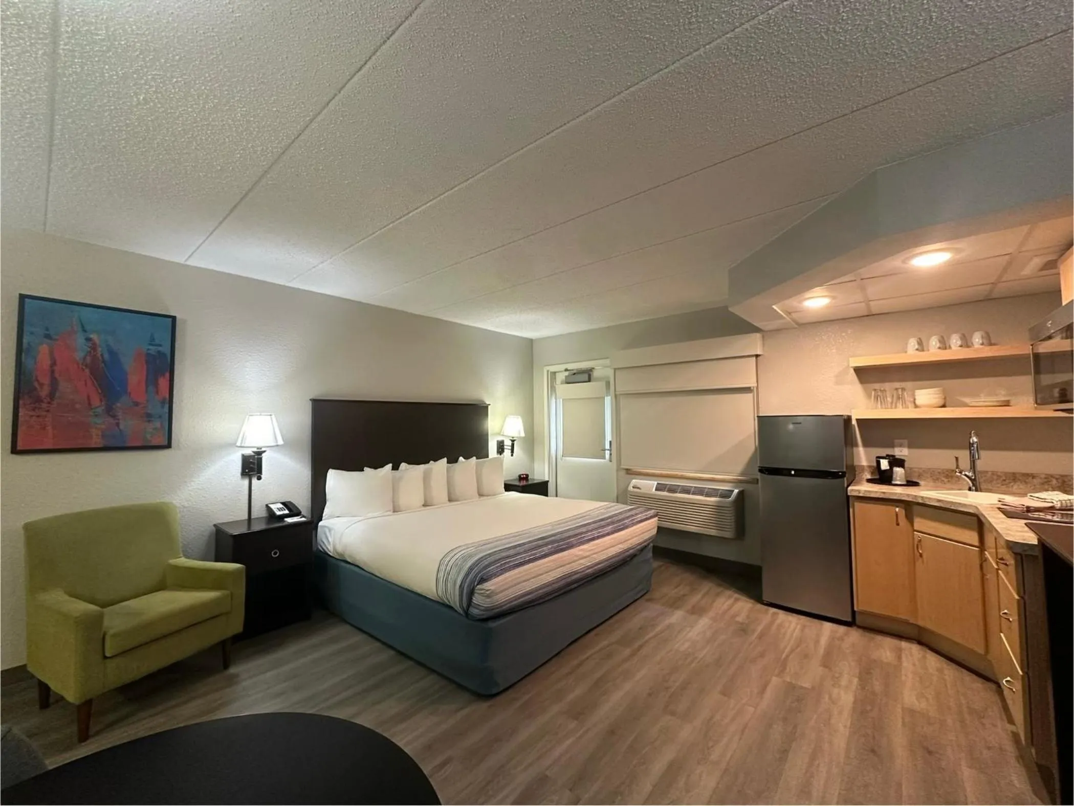 Bed in AmericInn by Wyndham Menominee