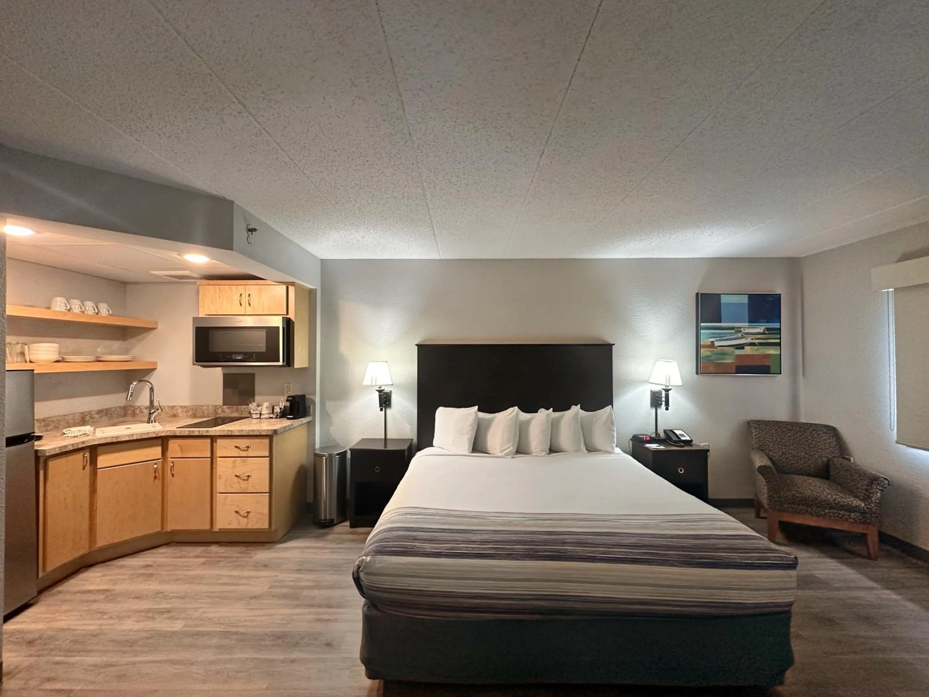 Bed in AmericInn by Wyndham Menominee