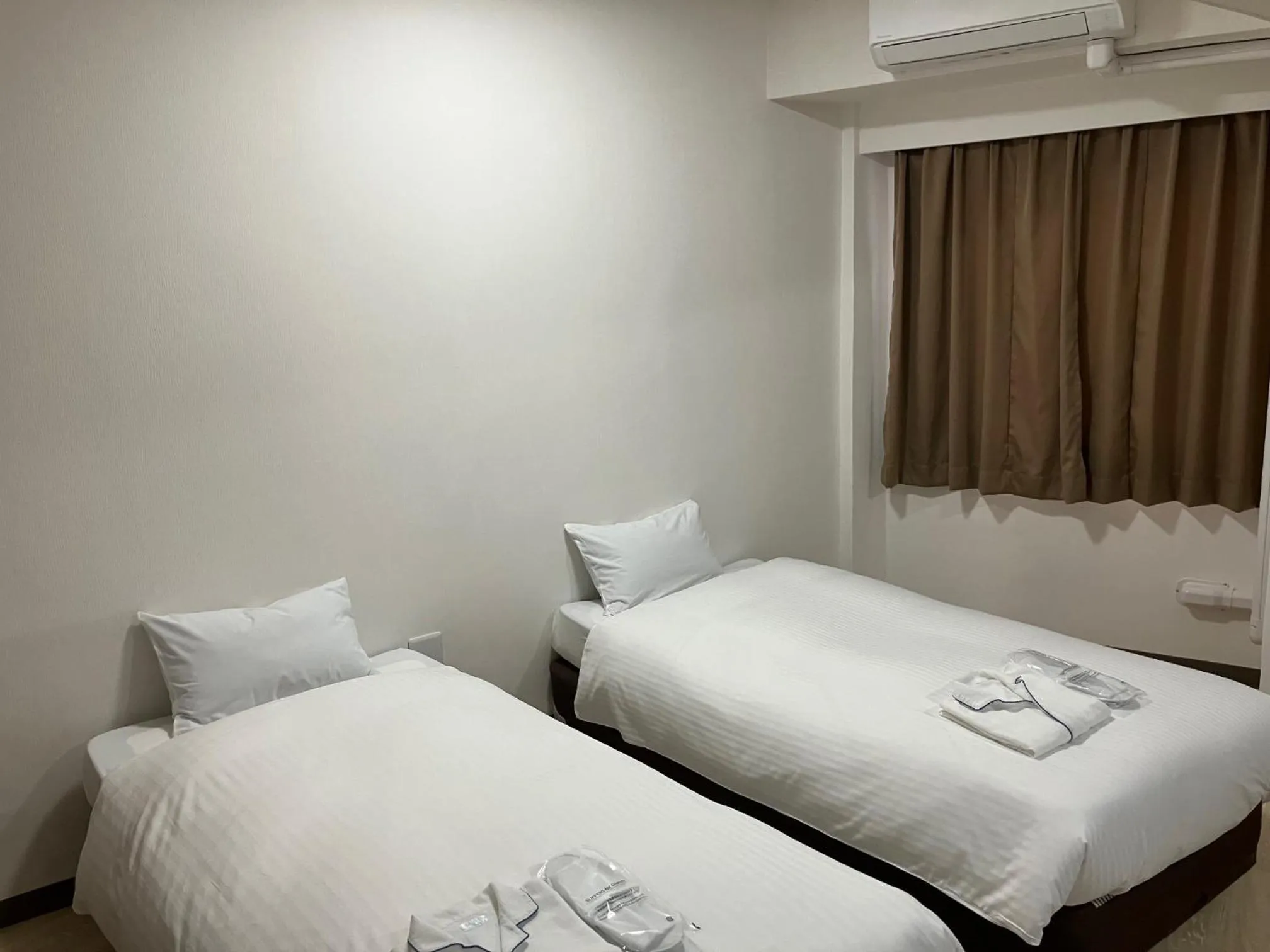 Bed in Enagic Okinawa Kokusai Plaza Hotel