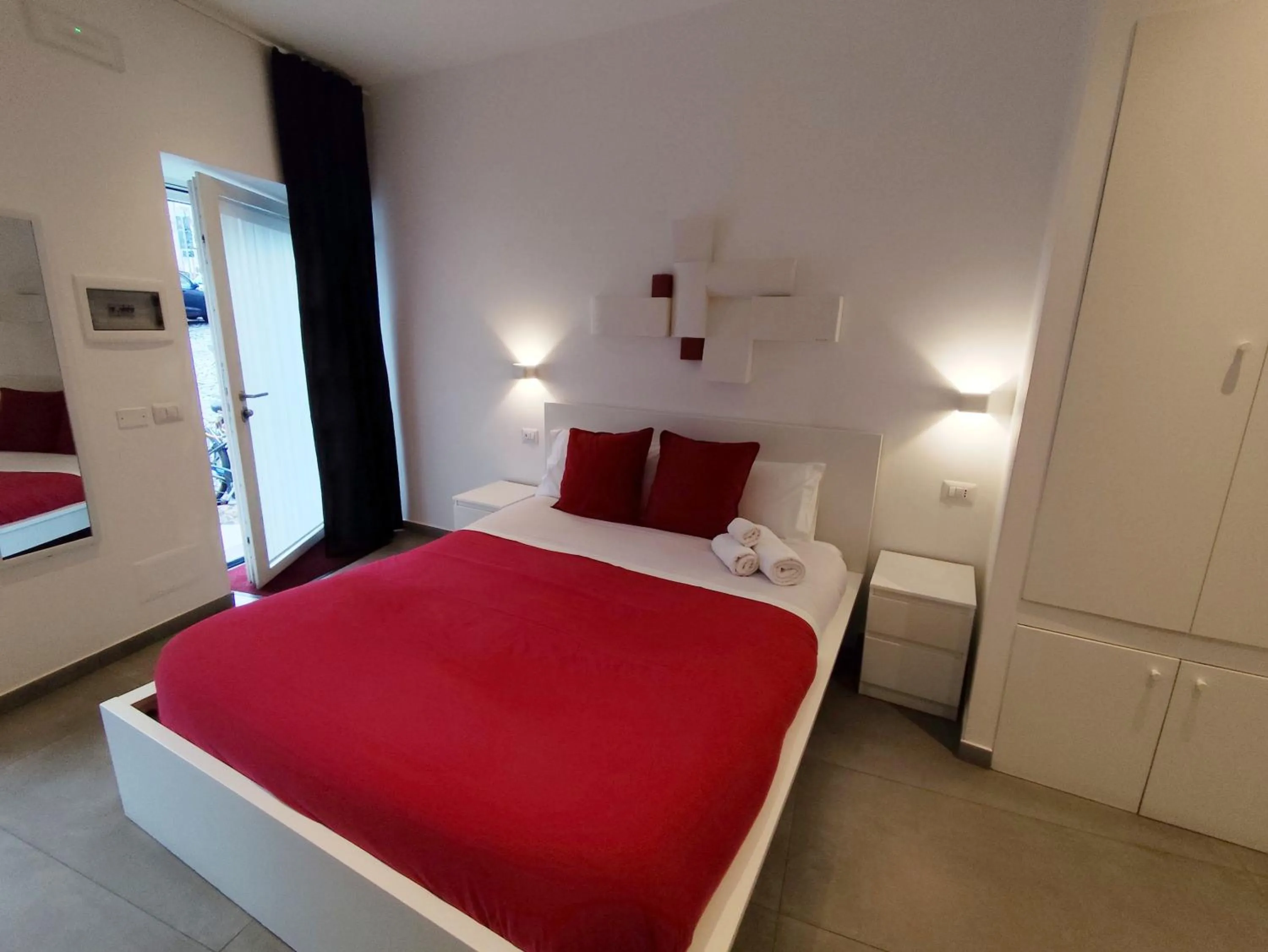 Bed in Palazzo Verdi Holiday Viterbo