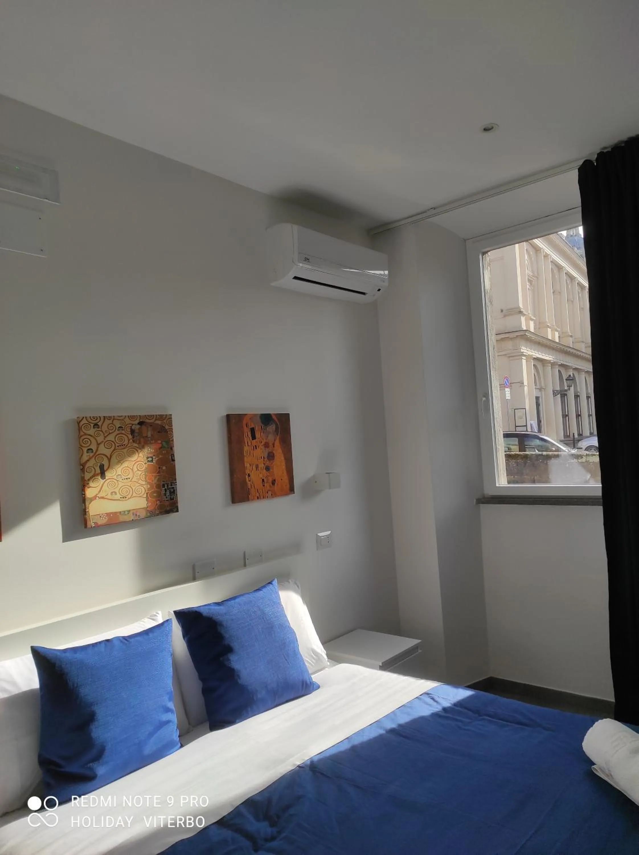 Bed in Palazzo Verdi Holiday Viterbo