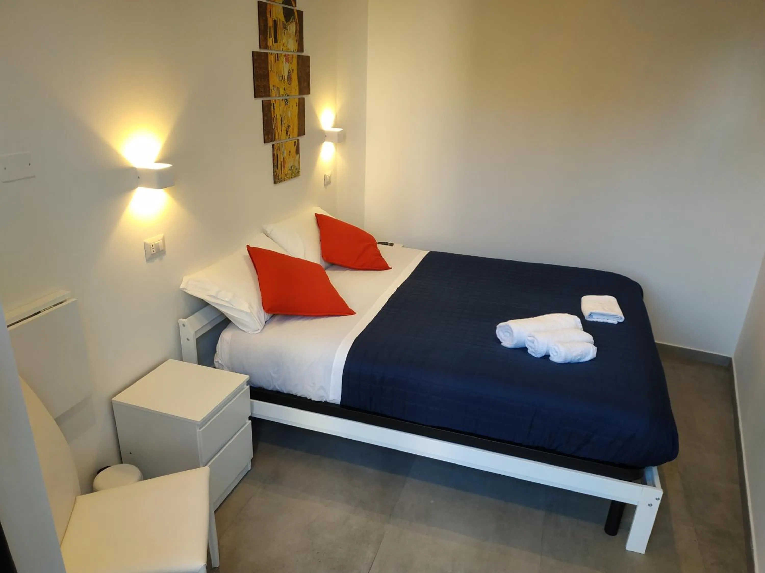 Bed in Palazzo Verdi Holiday Viterbo