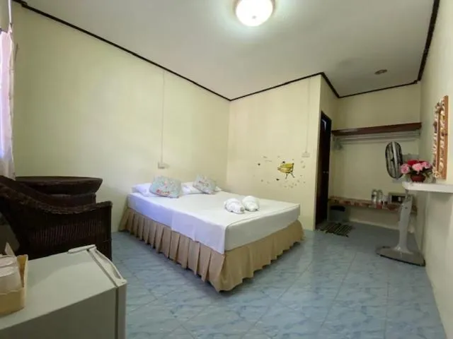 Bed in Baan Rom Mai Resort